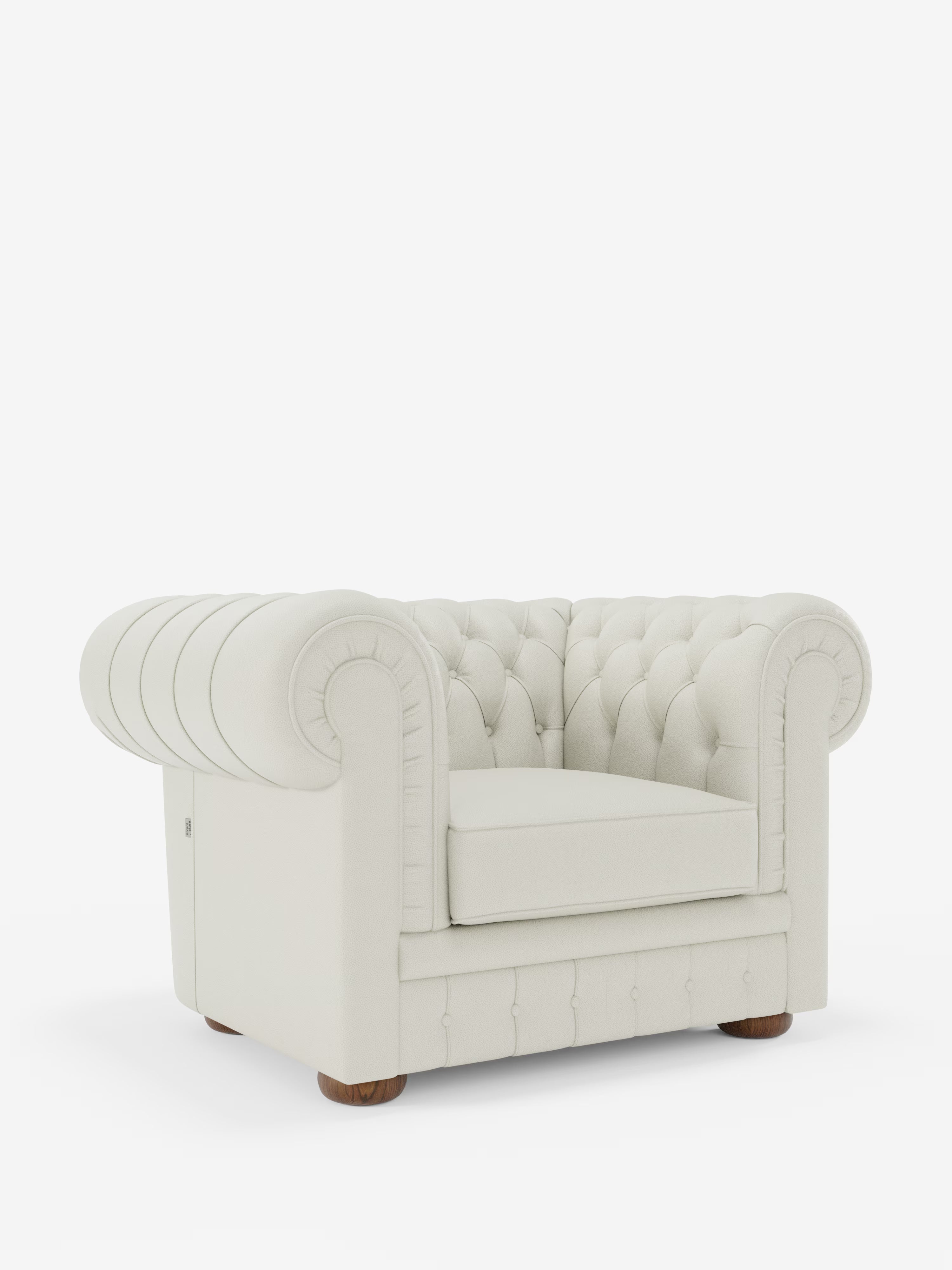 Vi presentiamo la poltrona Chester in vera pelle spessorata con capitonné artigianale di Divani.Store: questa lussuosa poltrona bianca è realizzata con maestria artigianale e presenta una profonda trapuntatura a bottoni, braccioli arrotondati, un unico cuscino di seduta in vera pelle di prima qualità e gambe corte in legno. Il suo design classico e lussuoso risalta magnificamente su uno sfondo bianco a tinta unita.