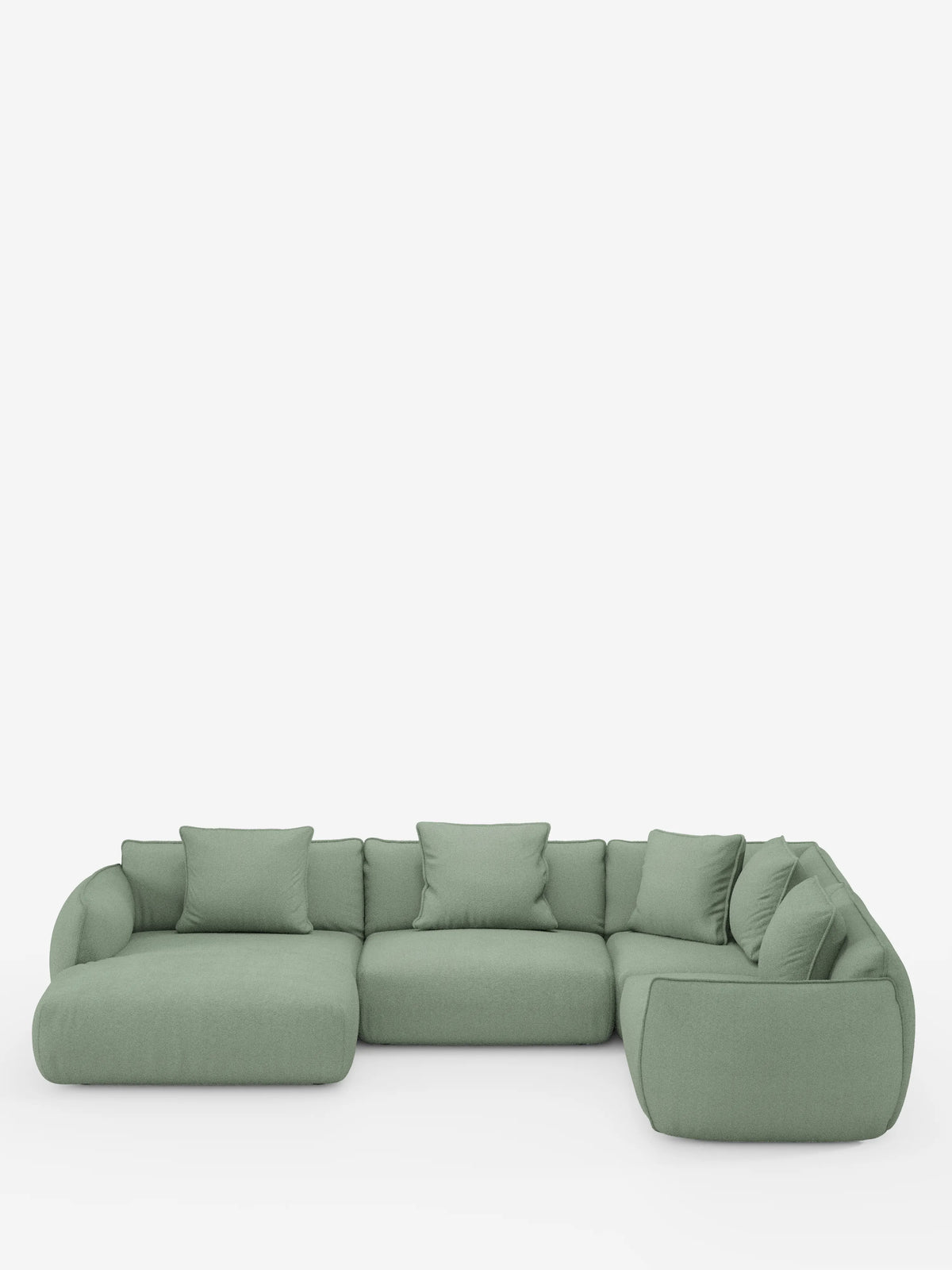Viene presentato un ampio divano angolare panoramico componibile Nimbus color verde salvia con penisola e angolo, rivestito in tessuto smacchiabile T33 di Divani.Store, caratterizzato da un design a L con bordi morbidi e arrotondati e cuscini coordinati per lo schienale e i fianchi. Su uno sfondo bianco a tinta unita, questo moderno divano componibile unisce comfort e stile, rendendolo un elemento centrale ideale per qualsiasi soggiorno all'insegna del relax e dell'eleganza.