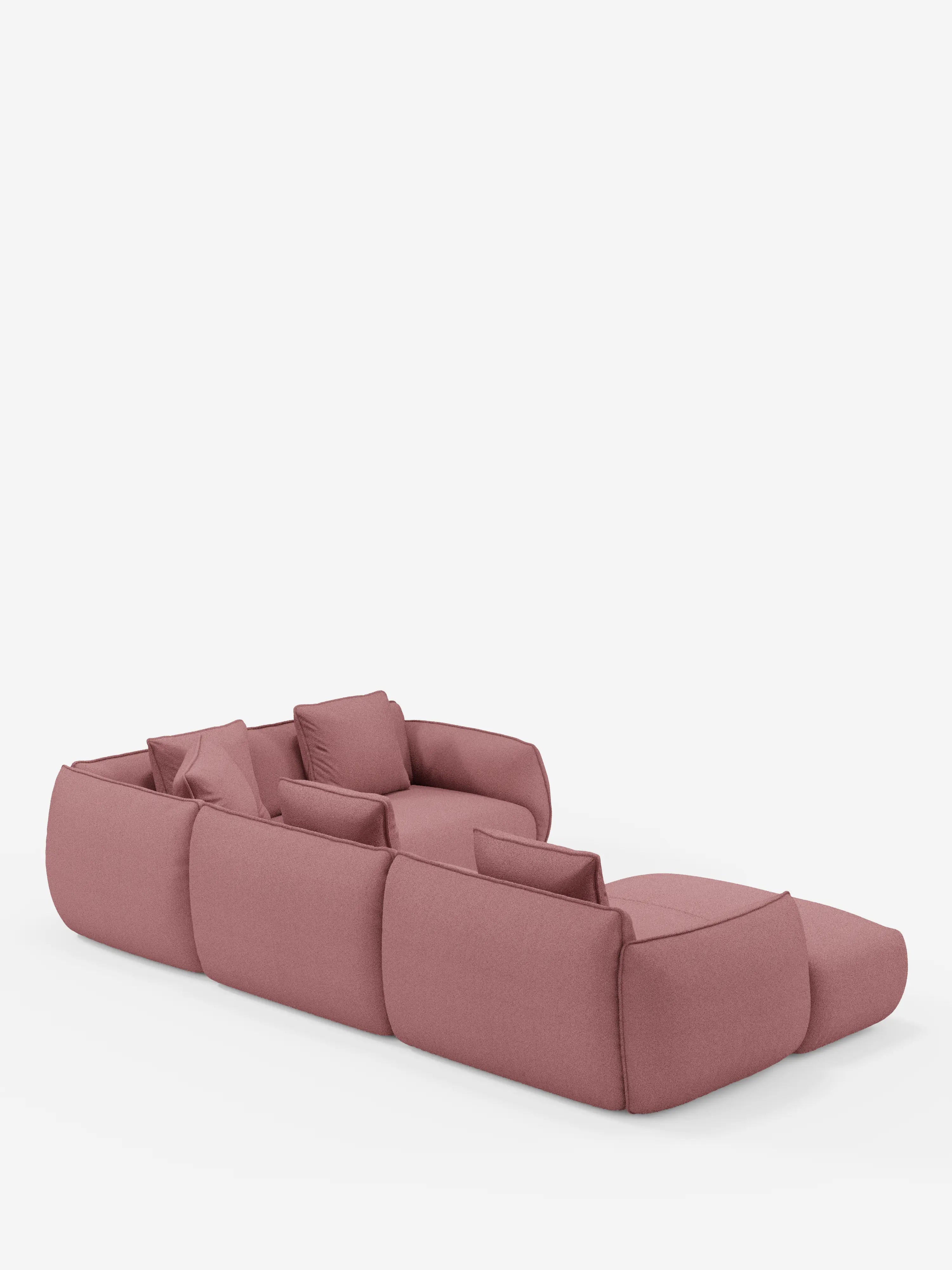 Un divano componibile contemporaneo, in una tonalità rosa antico — il divano angolare panoramico componibile Nimbus con penisola e angolo in tessuto smacchiabile T33 di Divani.Store — è presentato su uno sfondo bianco liscio. Realizzato in Italia, questo divano presenta cuscini morbidi, braccioli bassi, bordi arrotondati e un aspetto rilassato e accogliente.