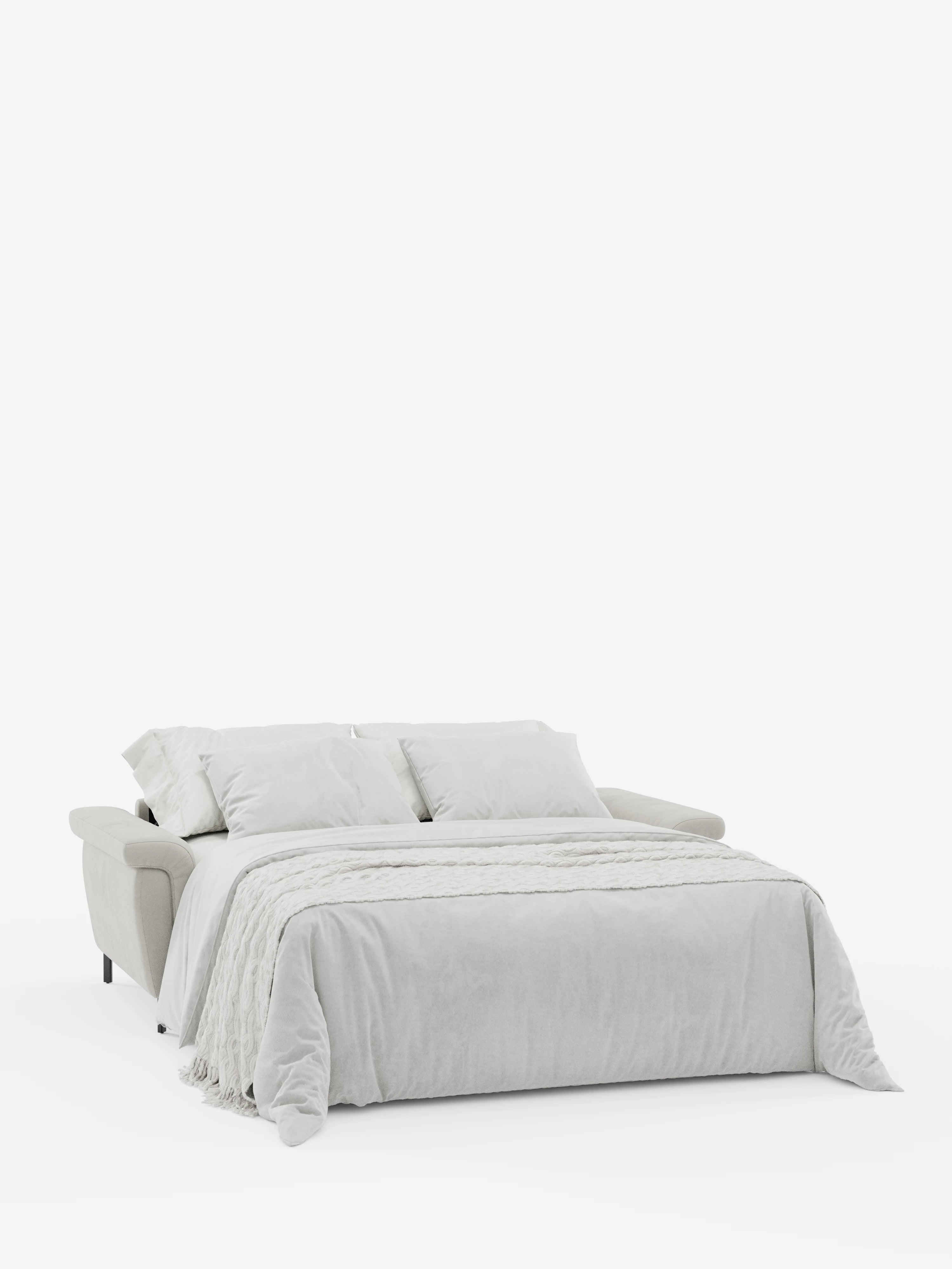 Un divano letto Capri di design di Divani.Store, in grigio chiaro, rivestito in un raffinato tessuto effetto velluto antimacchia (T30), è raffigurato aperto come letto su uno sfondo bianco a tinta unita. Il divano è dotato di due cuscini coordinati e di una coperta pesante, a testimonianza dell’alta qualità della manifattura italiana. Il suo stile moderno e minimalista è caratterizzato da braccioli morbidi e arrotondati, linee slanciate, piedini alti e poggiatesta reclinabili.