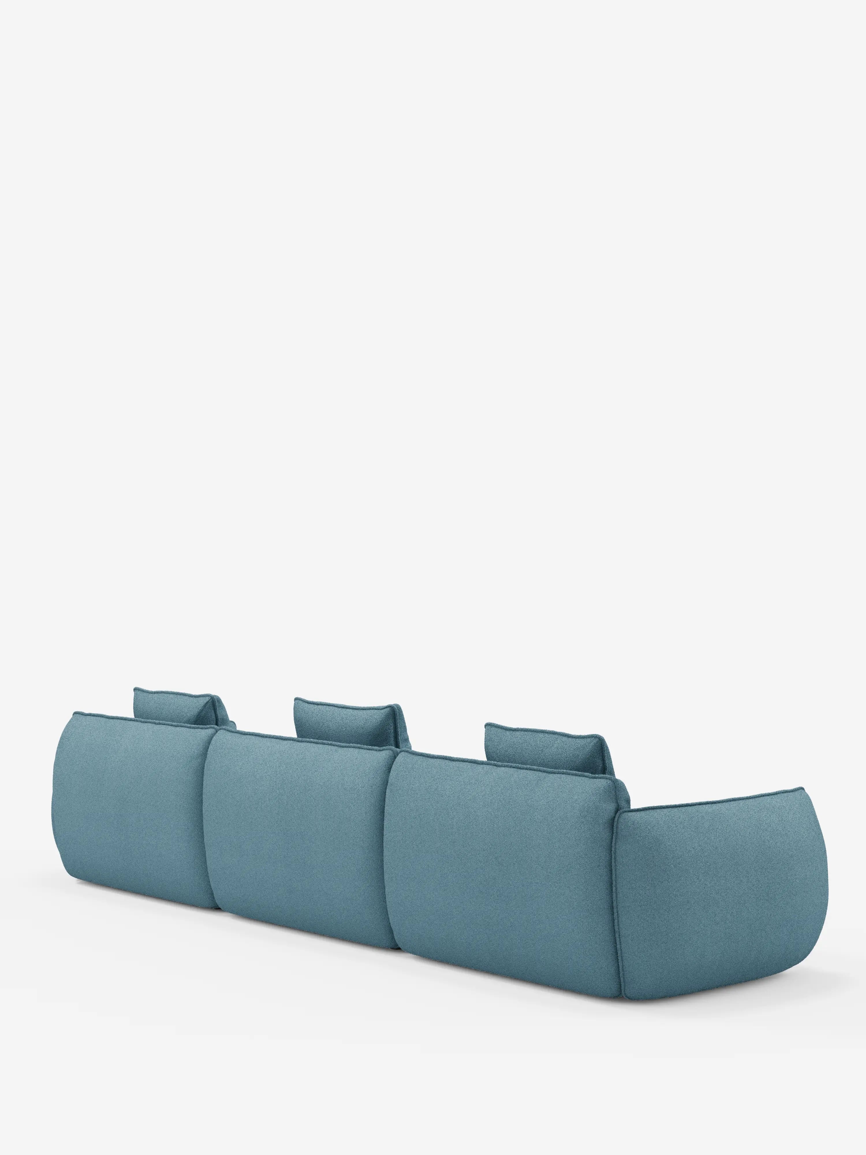 Vi presentiamo il divano modulare a 3 posti Nimbus, realizzabile in morbido tessuto smacchiabile effetto cotone T33 di Divani.Store: un moderno divano componibile blu caratterizzato da tre ampie sedute e cuscini dello schienale rettangolari, ripreso di retro su uno sfondo bianco a tinta unita. Questo divano componibile presenta bordi morbidi e arrotondati che ne definiscono l’estetica minimalista e contemporanea.