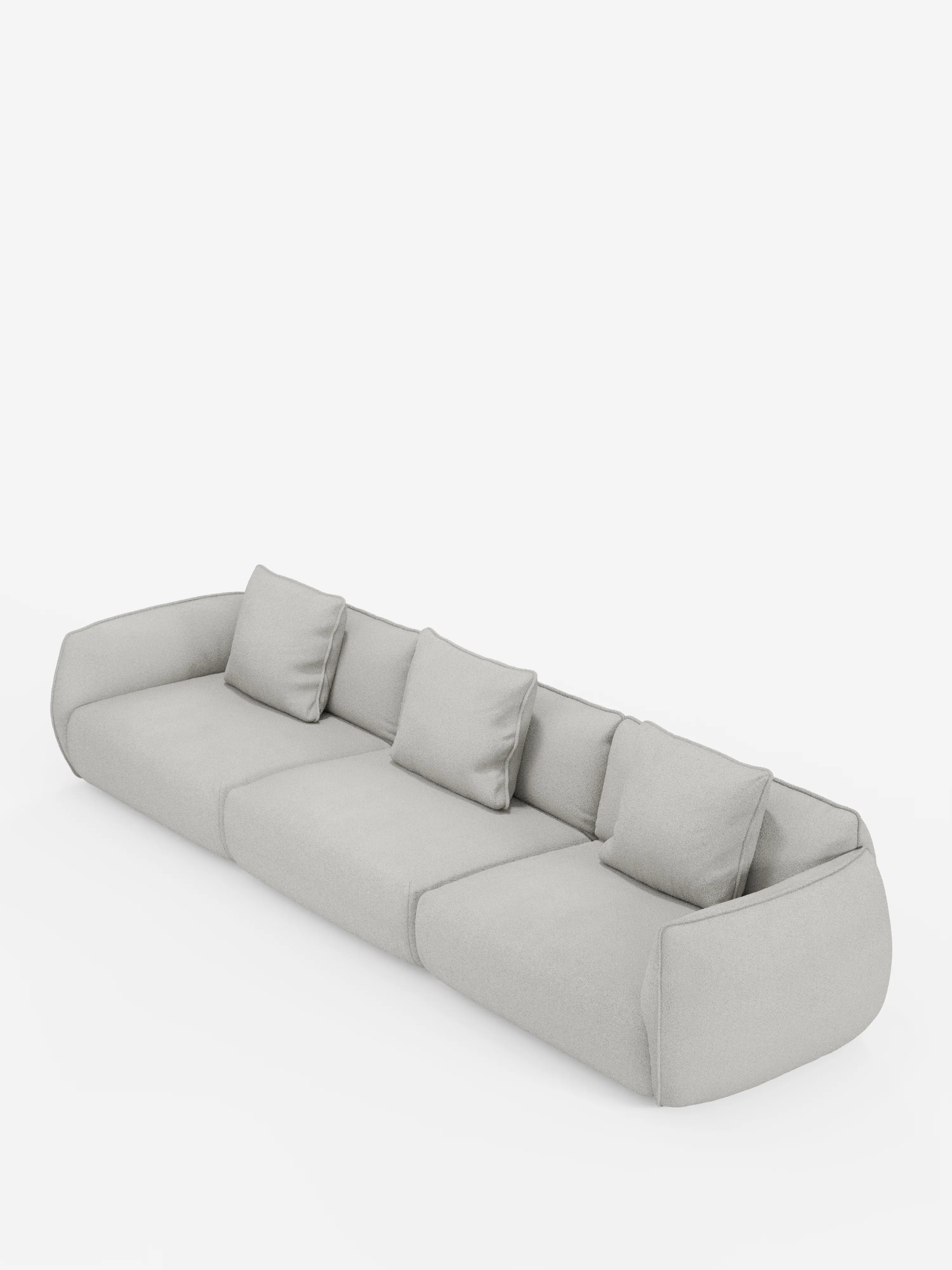Un divano modulare moderno a tre posti di colore grigio chiaro — Nimbus divano modulare a 3 sedute componibile di Divani.Store — realizzato in morbido tessuto effetto cotone resistente alle macchie (T33), caratterizzato da bordi arrotondati e morbidi e braccioli bassi. Quattro cuscini quadrati coordinati sono disposti a intervalli regolari lungo lo schienale. Questo divano sfoderabile è presentato su uno sfondo bianco a tinta unita.