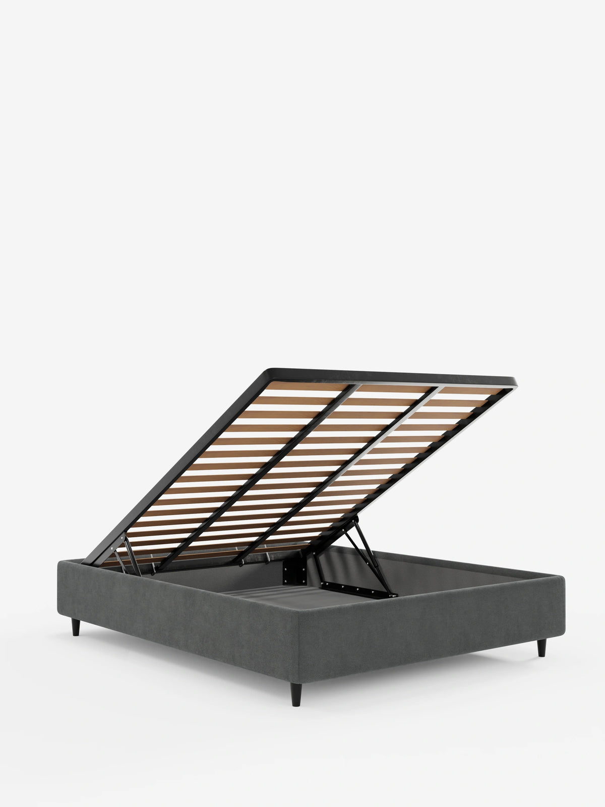 Un letto sommier imbottito ERON con vano contenitore in tessuto impermeabile certificato Oeko-Tex di colore grigio, raffigurato con la rete a doghe sollevata per mostrare lo spazio di contenimento, caratterizzato da gambe corte nere su sfondo bianco.
