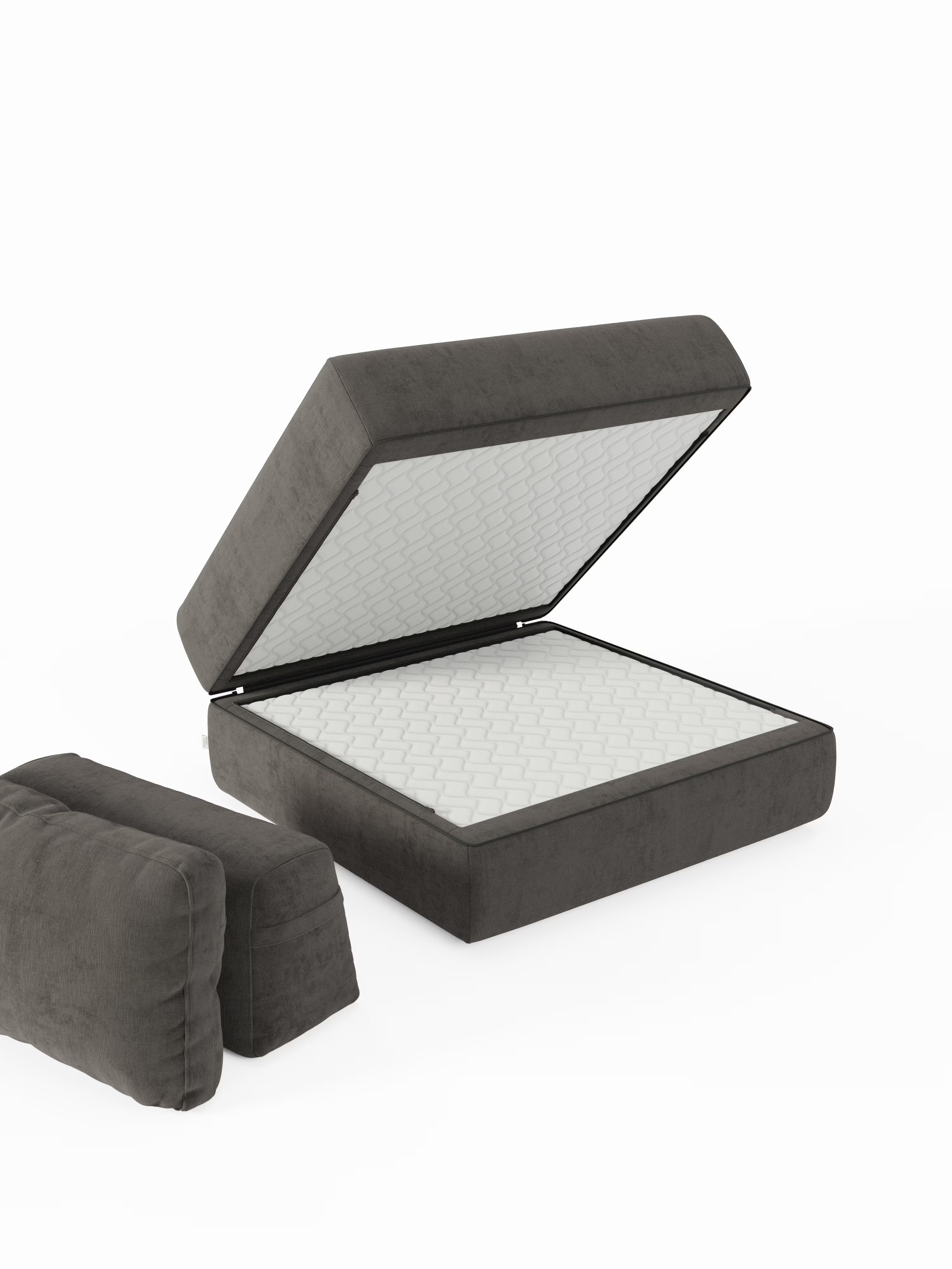 Una poltrona letto Rift grigio scuro con materasso alto 22 cm e memory foam di Divani.Il modello Store, rivestito in tessuto T31 antimacchia e dotato di schienale reclinabile, è raffigurato con la parte superiore sollevata per rivelare il materasso trapuntato bianco all’interno, mettendone in risalto la versatilità; due cuscini rettangolari abbinati sono posizionati separatamente a sinistra su uno sfondo bianco.