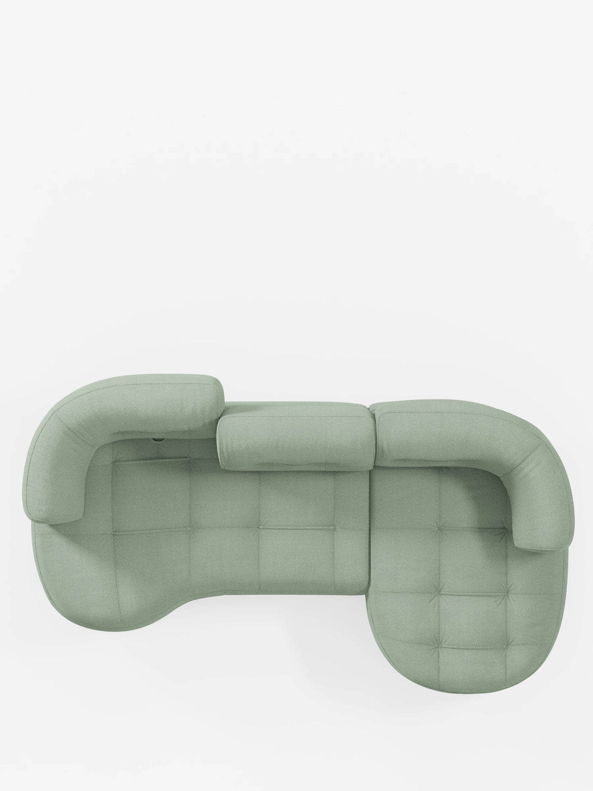 Vista dall'alto di un divano angolare Croissant di colore verde chiaro, dal design a forma di fagiolo e con schienali regolabili, rivestito in morbido tessuto effetto cotone smacchiabile T33.