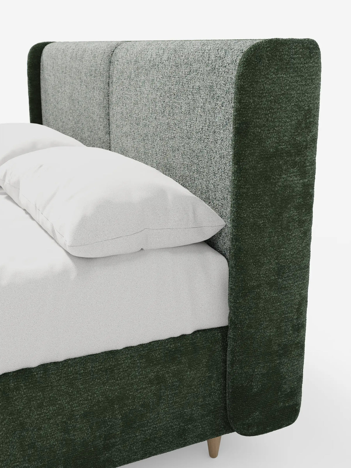 Vista laterale di un letto imbottito bicolore VALKIRIA con contenitore, caratterizzato da una struttura imbottita bicolore con tessuto testurizzato verde scuro sulla testiera curva e sulla base, affiancato da un cuscino bianco su lenzuola bianche.
