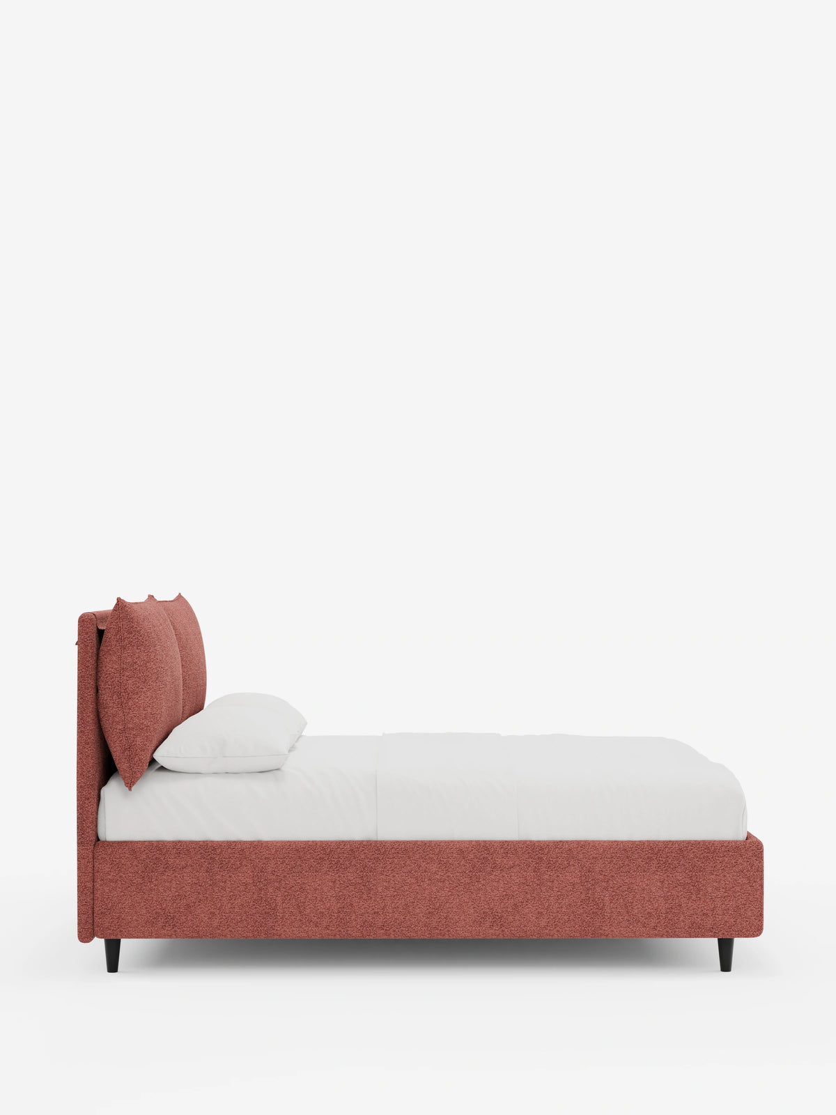Vista laterale di un letto imbottito ZAYRON con contenitore e morbidi cuscini regolabili in tessuto testurizzato color rosa antico, caratterizzato da due cuscini regolabili sulla testiera, biancheria da letto bianca e piccole gambe affusolate nere.
