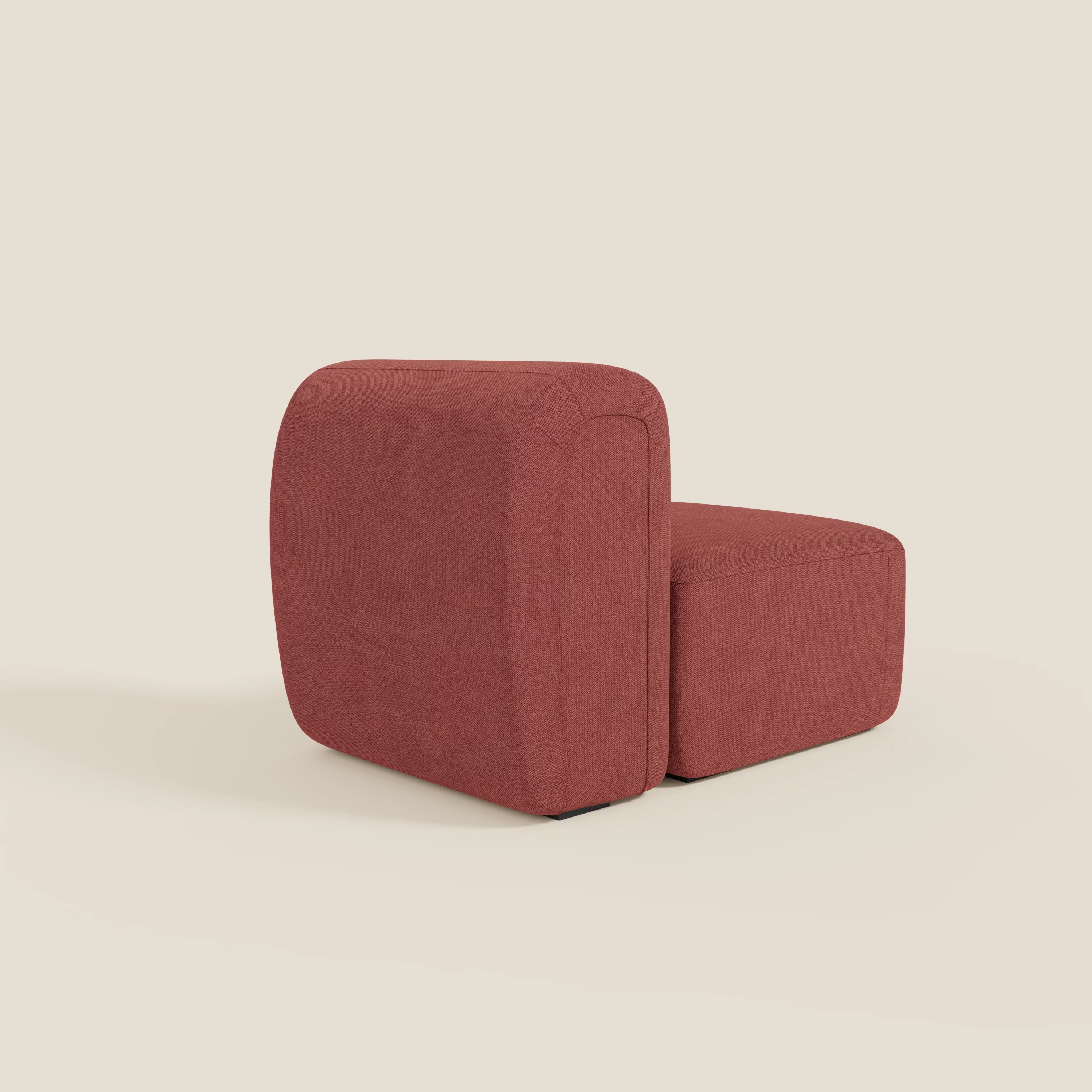 BonBon modulo centrale 70 cm di Divani.Store è una sedia moderna senza braccioli in tessuto antimacchia T23 rosso ciliegia, dai bordi morbidi e arrotondati e dal design minimalista e squadrato; è presentata ad angolo su uno sfondo bianco sporco.