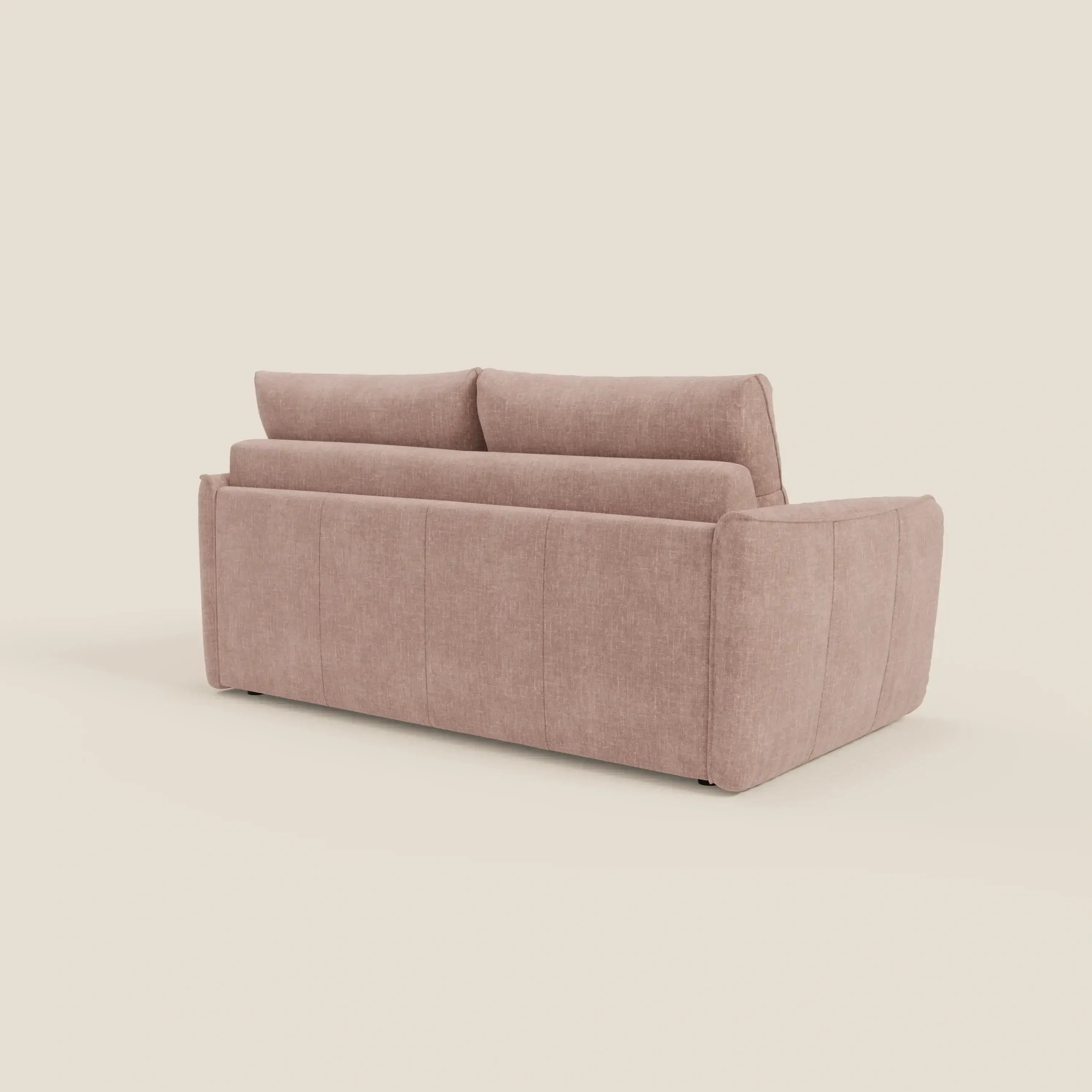 Il divano letto Elios Divani di Divani.Store in tessuto smacchiabile T24 rosa cipria, visto dalla parte posteriore, presenta un design moderno e squadrato con due morbidi cuscini di schienale, bordi arrotondati e sottili cuciture verticali su uno sfondo bianco sporco.