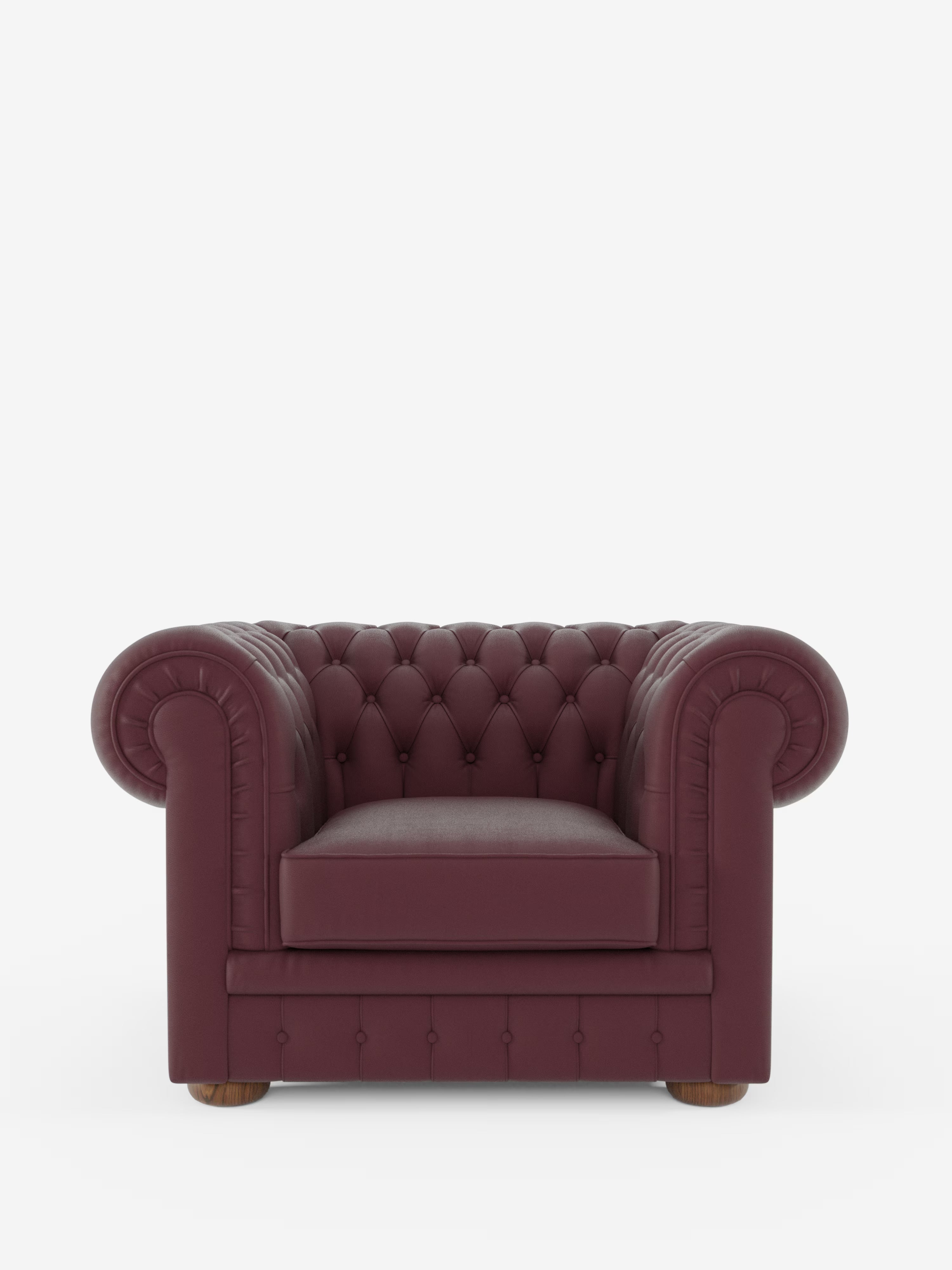 Vista frontale della poltrona Chester in vera pelle spessorata con capitonné artigianale di Divani.Store, caratterizzata da un rivestimento in vera pelle color bordeaux con capitonné artigianale a bottoni profondi nel classico stile capitonné, braccioli arrotondati, seduta imbottita e gambe in legno, su uno sfondo bianco a tinta unita.