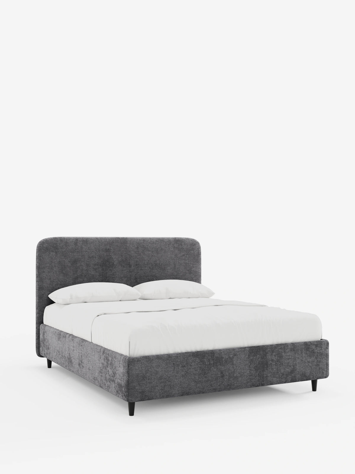 KAELOS, letto imbottito in stile minimal in grigio antracite, con testiera arrotondata e gambe alte e sottili di colore nero, rivestito con lenzuola bianche immacolate e due cuscini su uno sfondo grigio chiaro.