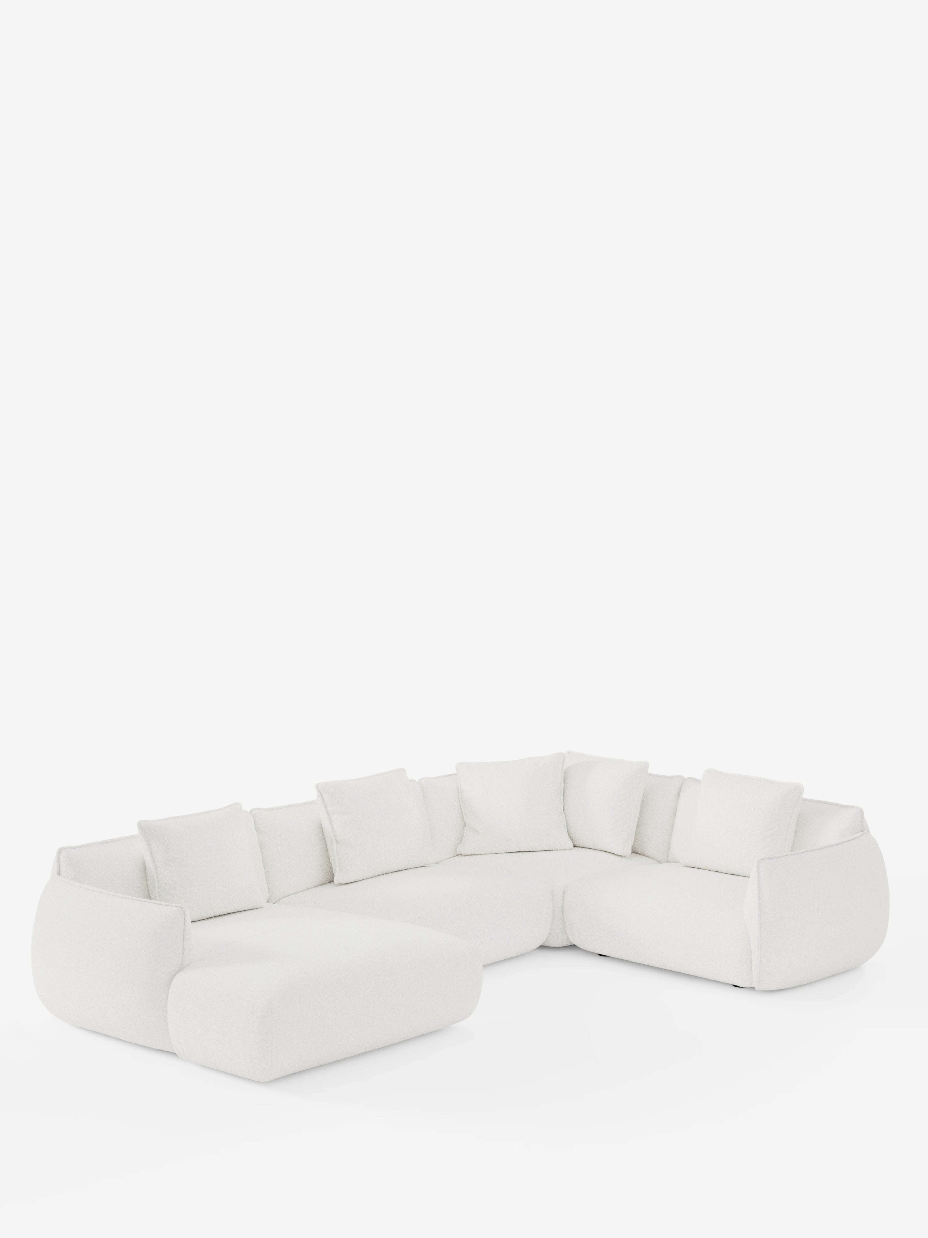 Un divano angolare panoramico componibile bianco contemporaneo “Nimbus” di Divani.Store, con penisola e angolo in tessuto smacchiabile T33: questo divano modulare a forma di L presenta schienali bassi, sette cuscini quadrati coordinati e morbidi bordi arrotondati. Su uno sfondo bianco a tinta unita, il suo design minimalista e il tessuto antimacchia creano un look pulito e accogliente che incarna alla perfezione lo stile italiano moderno.