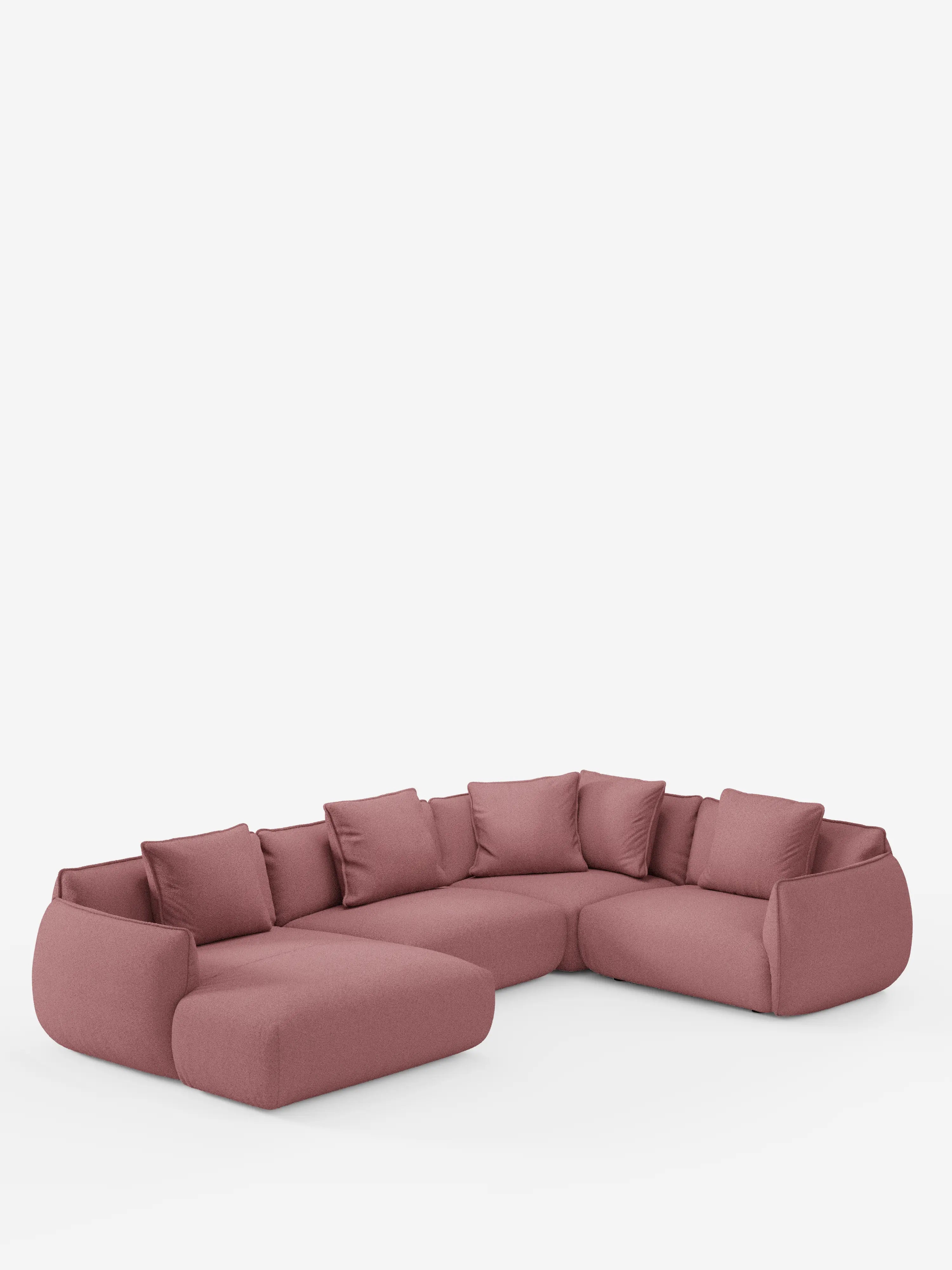 Un divano angolare panoramico componibile Nimbus in stile contemporaneo, a forma di L, con penisola e angolo, firmato Divani.Store, è presentato in un tessuto T33 rosa tenue e facile da pulire. Il divano presenta schienali bassi e cuscini ampi e morbidi, accompagnati da sette cuscini decorativi coordinati. I suoi bordi lisci e arrotondati e la silhouette morbida e accogliente risaltano su uno sfondo bianco a tinta unita.