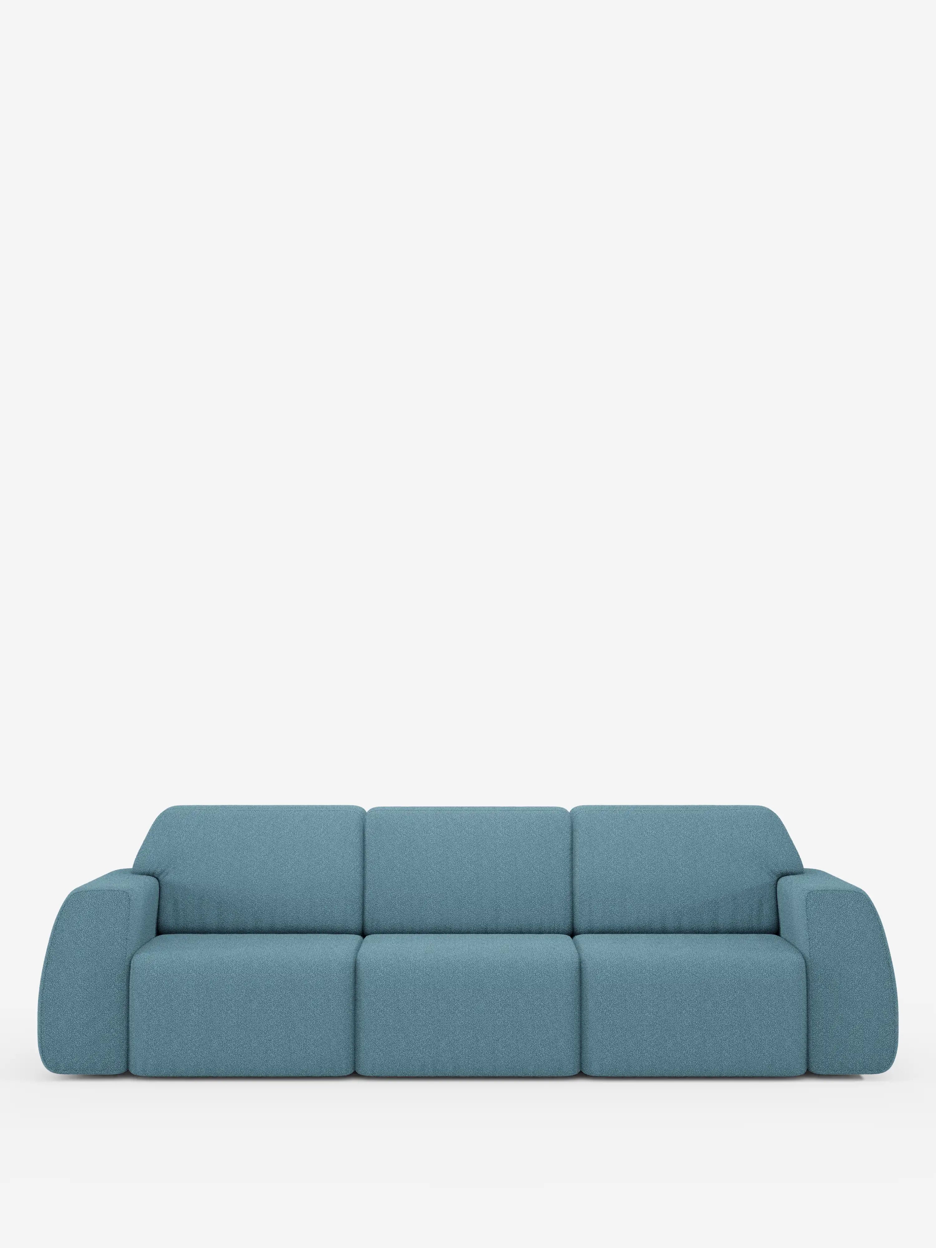 Il divano Orbit di Divani.Store è un moderno divano a tre posti rivestito in tessuto effetto cotone (T33) di colore azzurro, resistente alle macchie. Il suo design è caratterizzato da morbidi cuscini squadrati con braccioli arrotondati e tre sedute indipendenti scorrevoli e allungabili per un comfort personalizzato. Sullo sfondo bianco a tinta unita, le linee pulite e lo stile minimalista del divano risaltano magnificamente.
