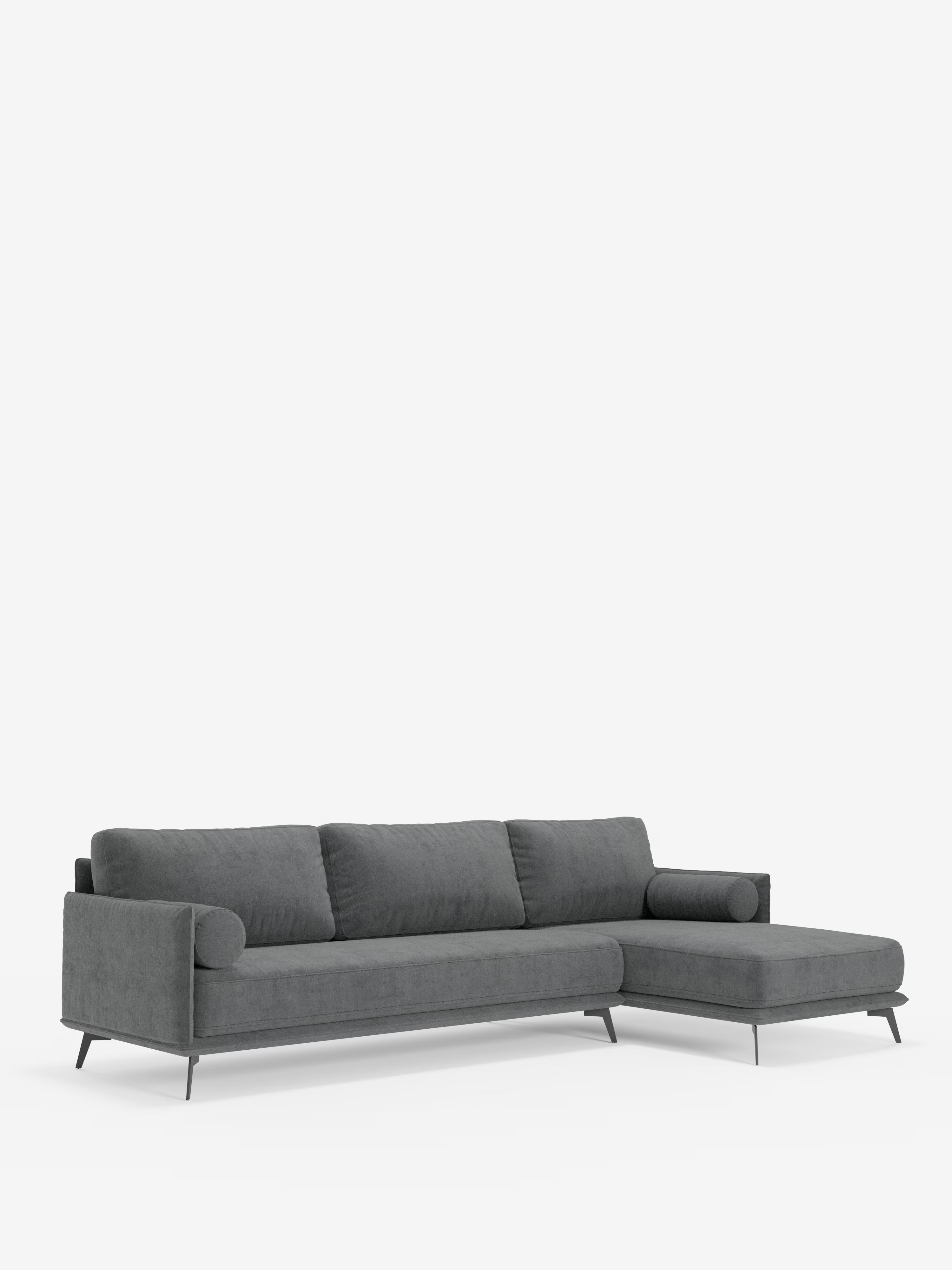 Il divano moderno angolare con penisola Basalto di Divani.Store presenta un rivestimento in tessuto T31 grigio scuro resistente alle macchie, tre cuscini dello schienale imbottiti in piuma, una chaise longue sul lato destro e una robusta base in metallo con sottili gambe nere. Realizzato in Italia, questo divano moderno presenta linee pulite e minimaliste e risalta in modo particolare su uno sfondo bianco a tinta unita.