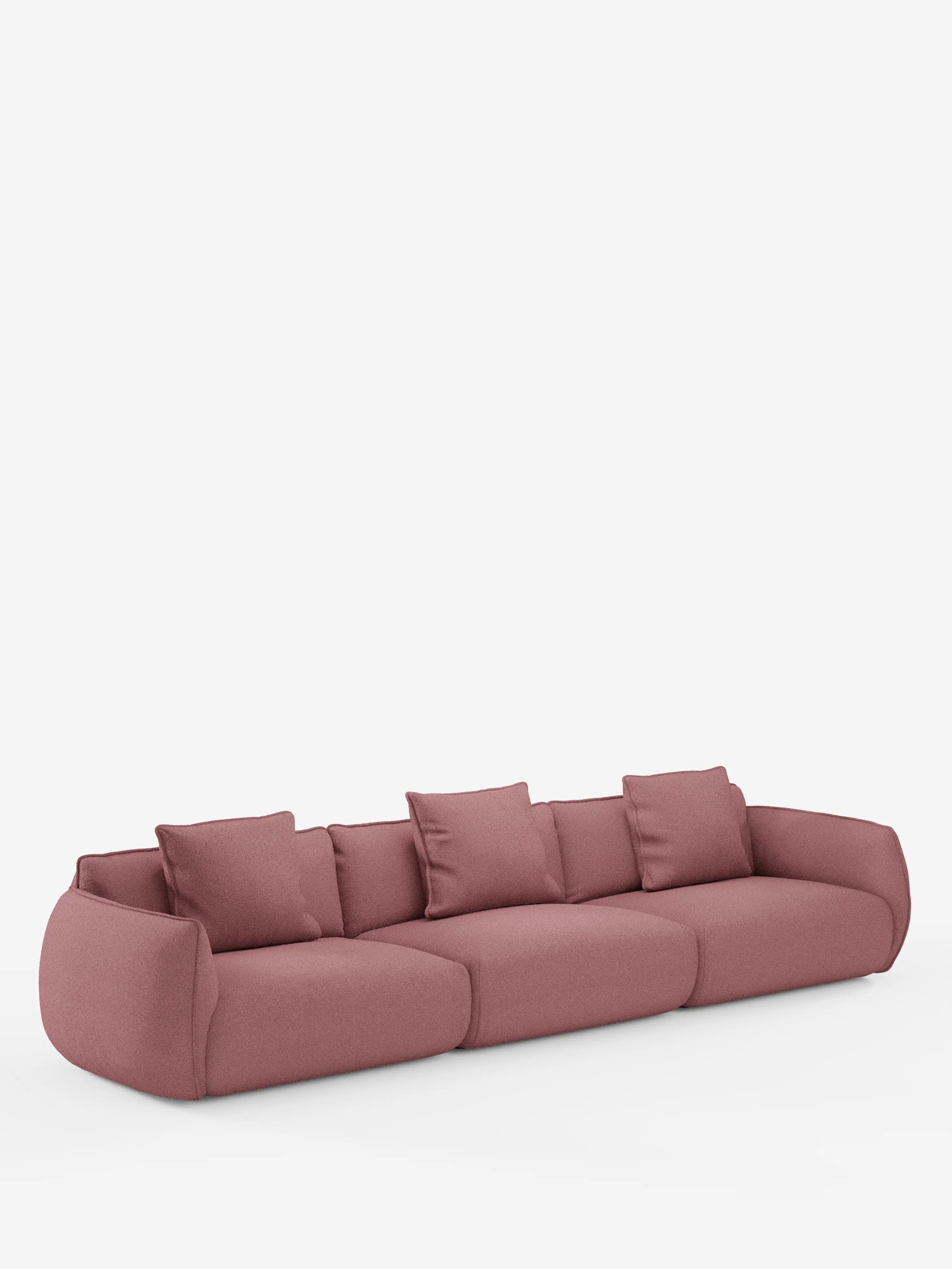 Un divano modulare contemporaneo e dal profilo basso, il modello Nimbus a 3 posti di Divani.Store, rivestito in morbido tessuto T33 color malva effetto cotone, resistente alle macchie. Questo divano modulare presenta bordi delicatamente arrotondati, tre cuscini di seduta e tre cuscini dello schienale abbinati, il tutto su uno sfondo bianco a tinta unita.