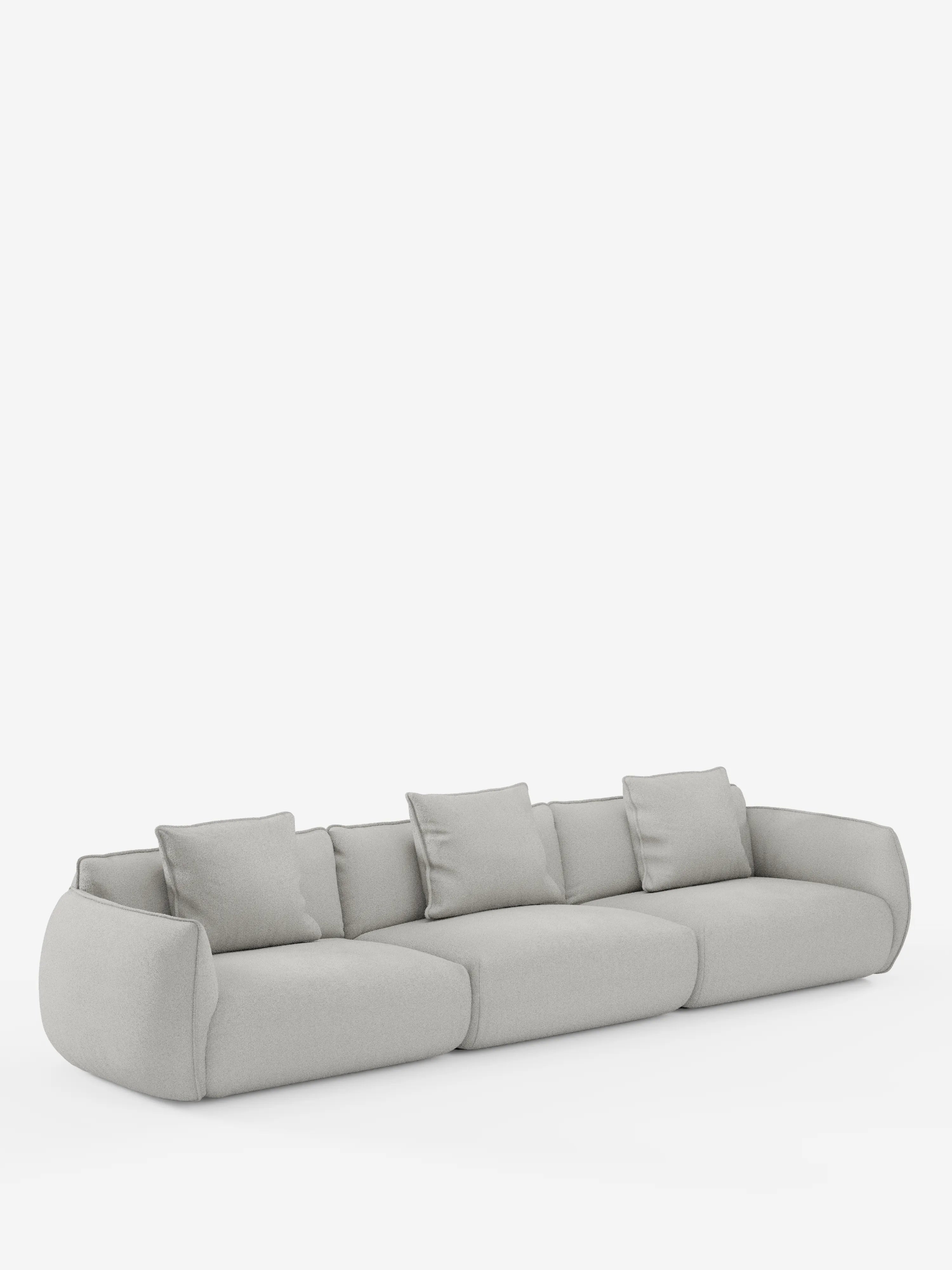 Un moderno divano modulare Nimbus a 3 posti, di colore grigio chiaro, realizzato da Divani.Store, è rivestito in morbido tessuto T33 effetto cotone, resistente alle macchie, presenta morbidi bordi arrotondati ed è dotato di quattro cuscini quadrati coordinati per lo schienale. Il divano sfoderabile poggia su una superficie piana su uno sfondo bianco semplice.
