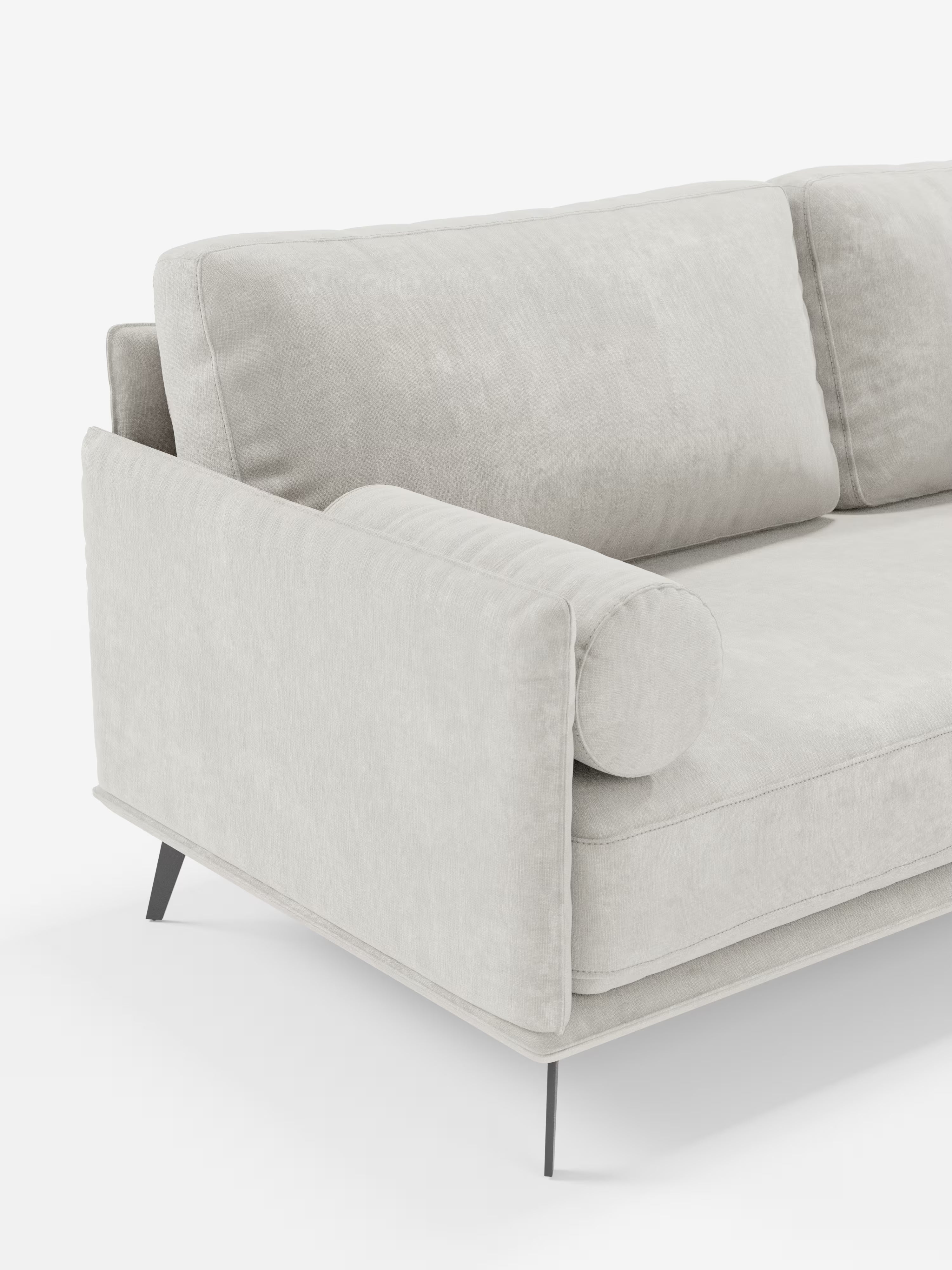 Vi presentiamo il Basalto Divano moderno angolare con penisola di Divani.Store: un divano italiano dal design moderno, rivestito in tessuto T31 grigio chiaro e resistente alle macchie. Questo modello dalle linee eleganti è caratterizzato da morbidi cuscini in piuma, un cuscino cilindrico sul bracciolo e sottili gambe in metallo nero. Il rivestimento morbido e vellutato e le linee pulite e minimaliste risaltano magnificamente su uno sfondo bianco.