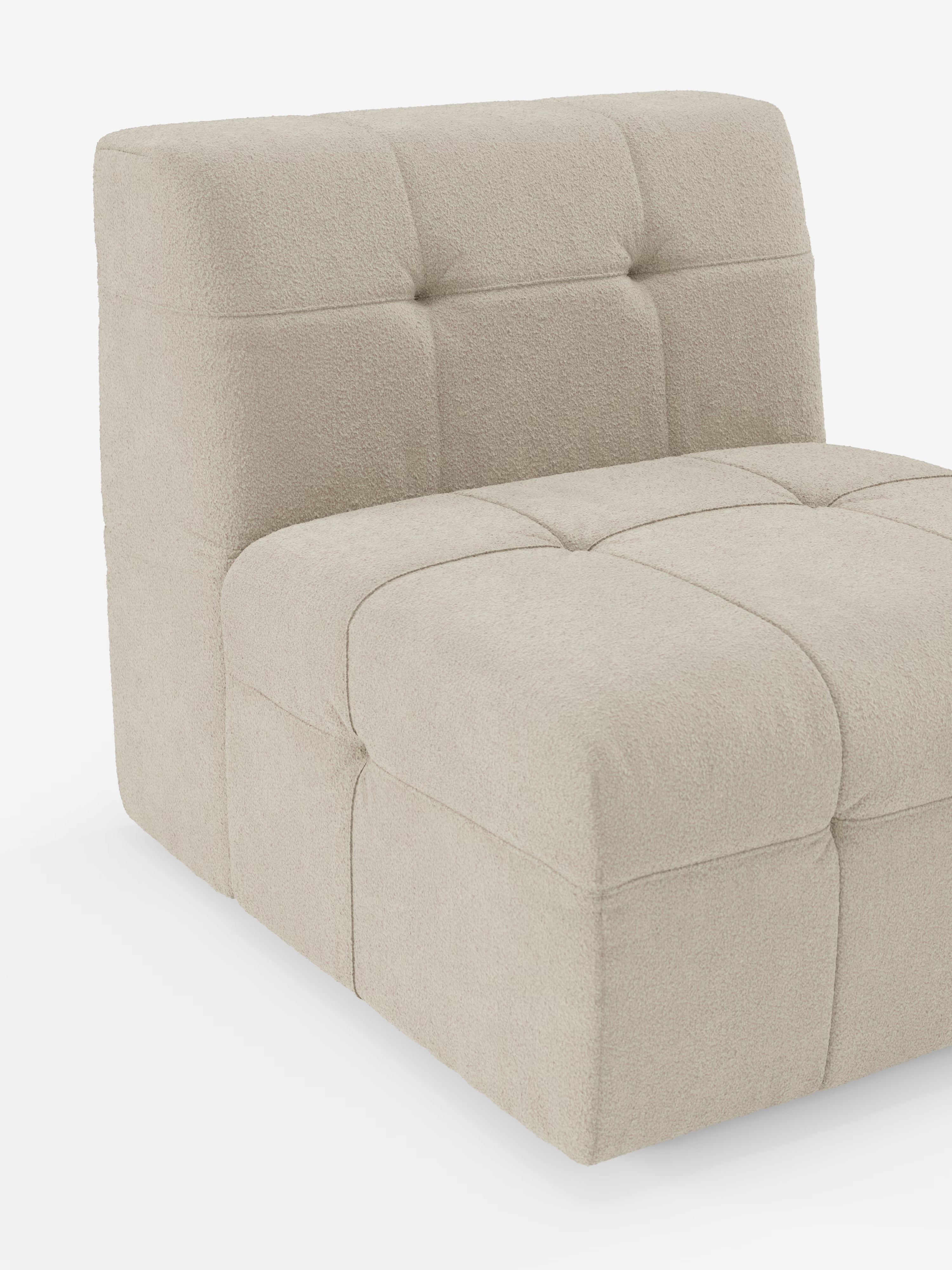 Vi presentiamo la poltrona Mosaic Modulo da 77 cm di Divani.Store: una poltrona moderna senza braccioli, caratterizzata da un elegante rivestimento in bouclé beige realizzato in tessuto T21 antimacchia e lavabile. La seduta e lo schienale presentano un'ampia trapuntatura capitonné a quadrati che conferisce un aspetto morbido e imbottito. Con il suo design a profilo ribassato che poggia direttamente sul pavimento e senza gambe a vista, questa poltrona aggiunge uno stile contemporaneo a qualsiasi ambiente.