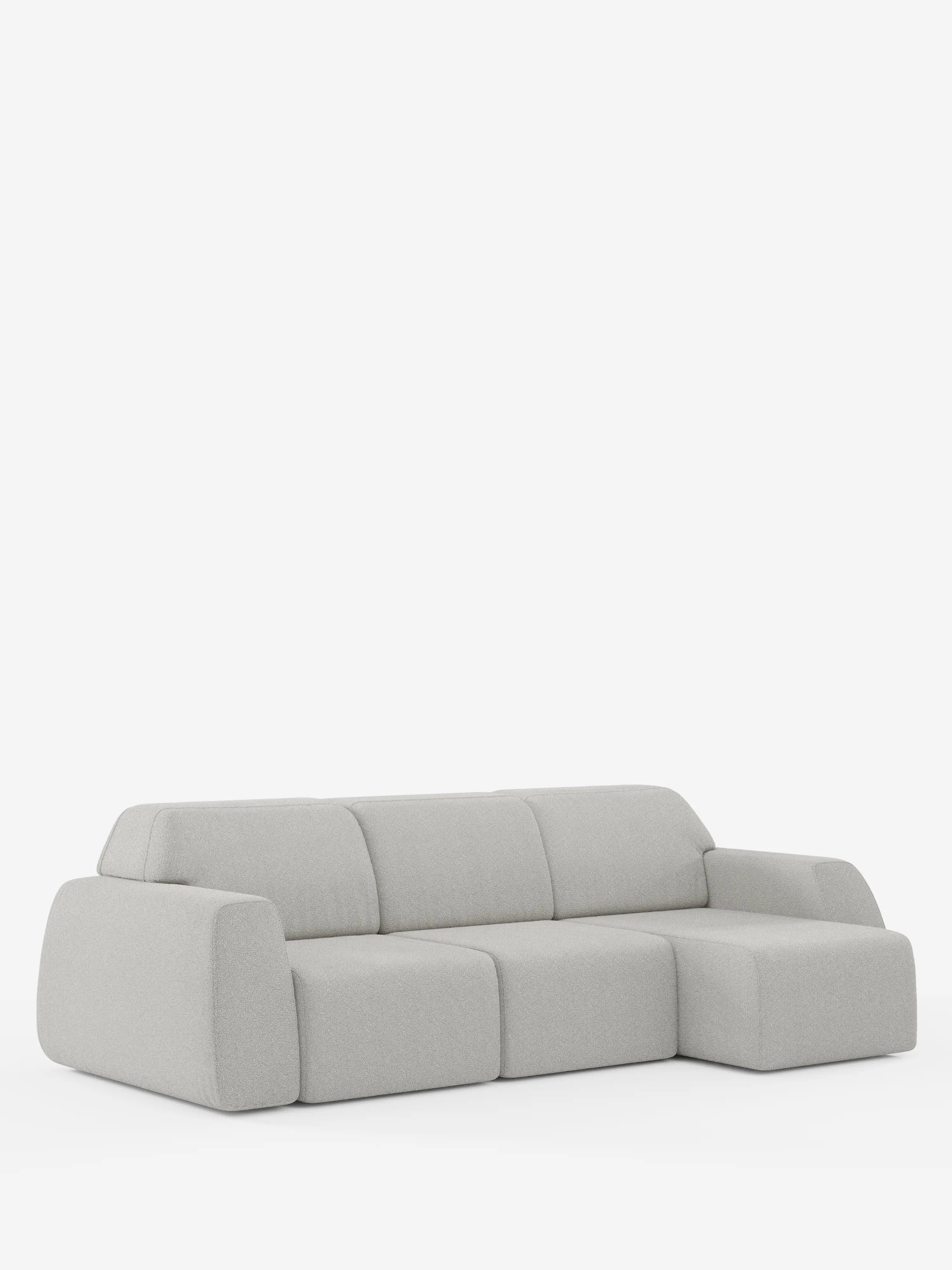 Ecco la frase riscritta utilizzando i dati del prodotto forniti: Il divano angolare Orbit con penisola reversibile e tutte le sedute allungabili in tessuto smacchiabile effetto cotone T33 di Divani.Store è un moderno divano componibile grigio chiaro con tre cuscini di seduta e una chaise longue sul lato destro, caratterizzato da bordi morbidi e arrotondati e da un design minimalista, qui raffigurato su uno sfondo bianco a tinta unita.