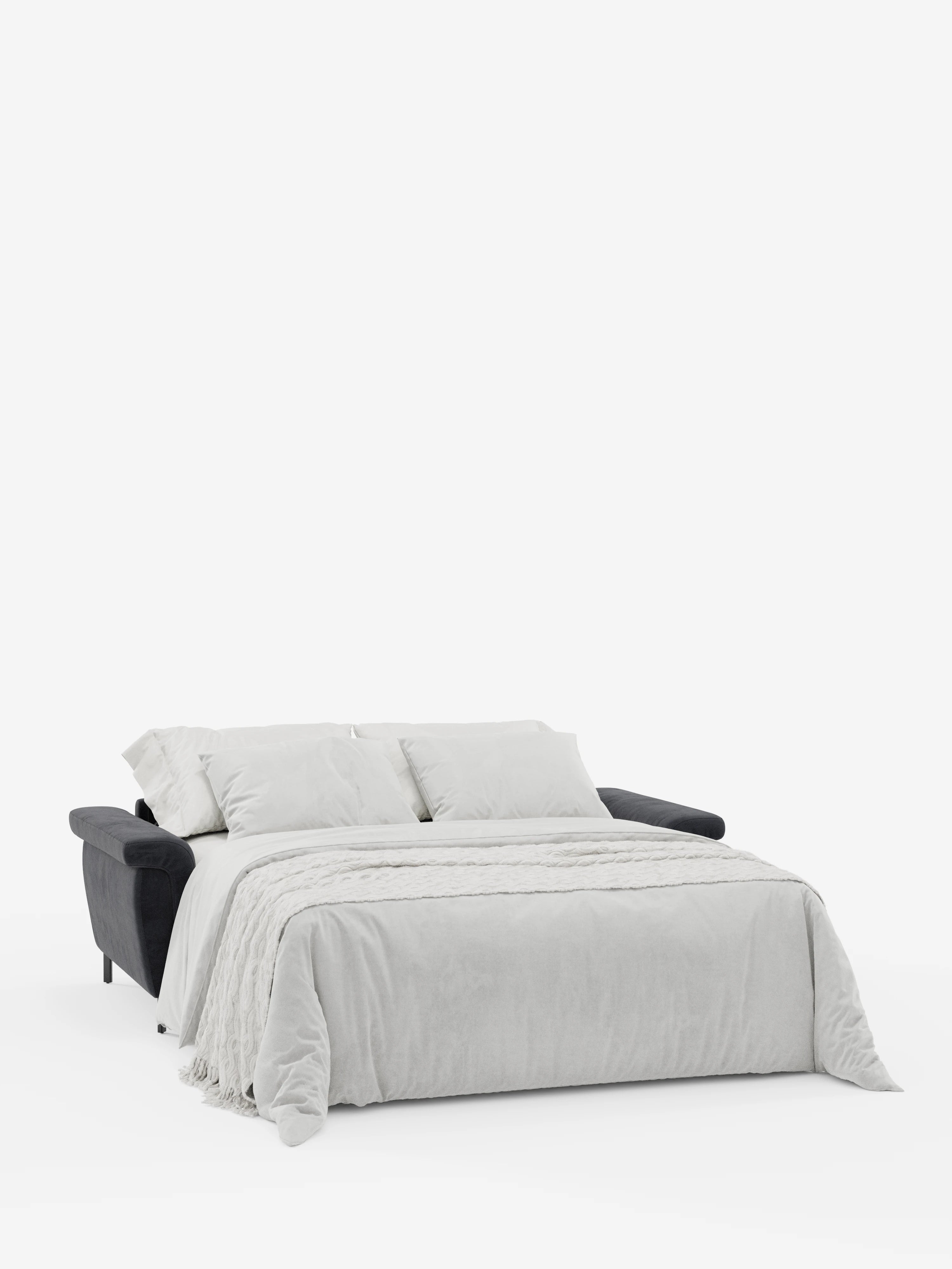 Su uno sfondo bianco a tinta unita, il divano letto di design Capri con piedini alti di Divani.Store — rivestito in raffinato tessuto T30 effetto velluto, resistente alle macchie, in un moderno grigio scuro — è aperto e abbellito da una biancheria da letto grigio chiaro, composta da un piumone, tre grandi cuscini e un plaid con frange. I suoi poggiatesta regolabili ne esaltano il fascino contemporaneo.