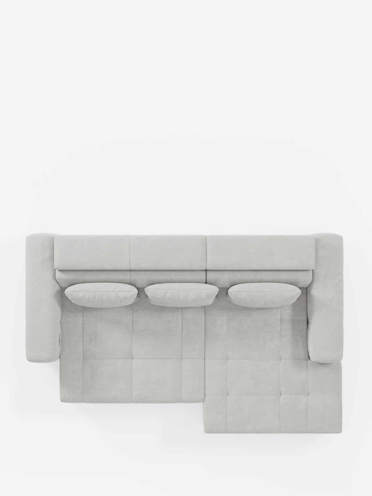 Vista dall'alto del divano angolare con penisola e funzione Relax elettrica per l'allungamento delle sedute “Monarch” di Divani.Store, rivestito in morbido tessuto T31 grigio chiaro, resistente alle macchie. Il divano componibile presenta un design a forma di L con tre cuscini rotondi lungo lo schienale, poggiatesta regolabili e linee squadrate e pulite che ricordano un moderno divano con penisola, il tutto su uno sfondo bianco a tinta unita.