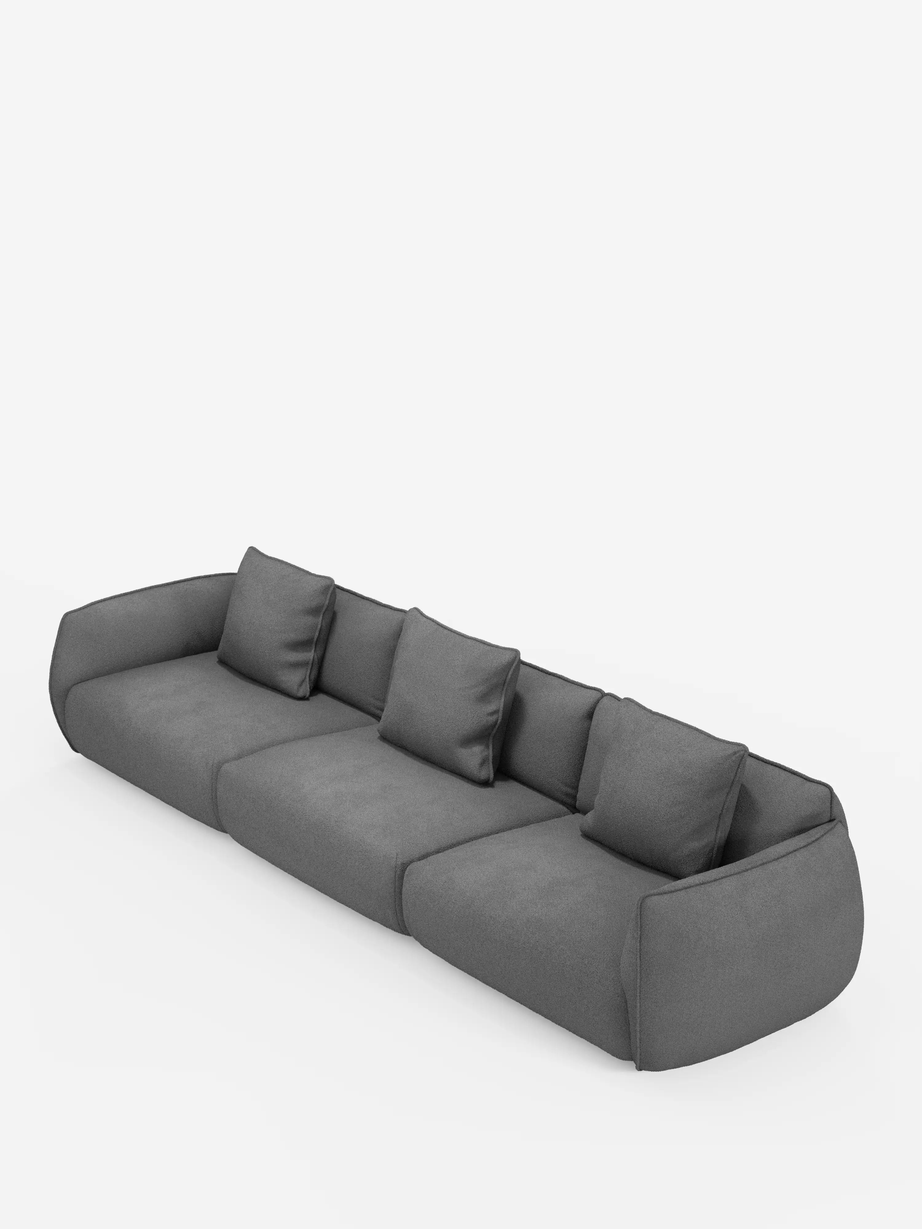 Un divano modulare Nimbus moderno e dal profilo basso, a 3 posti, realizzabile in morbido tessuto smacchiabile effetto cotone T33 di Divani.Store, in grigio scuro con tre cuscini di seduta e tre cuscini dello schienale abbinati, caratterizzato da braccioli arrotondati e da un design minimalista, su uno sfondo bianco a tinta unita.