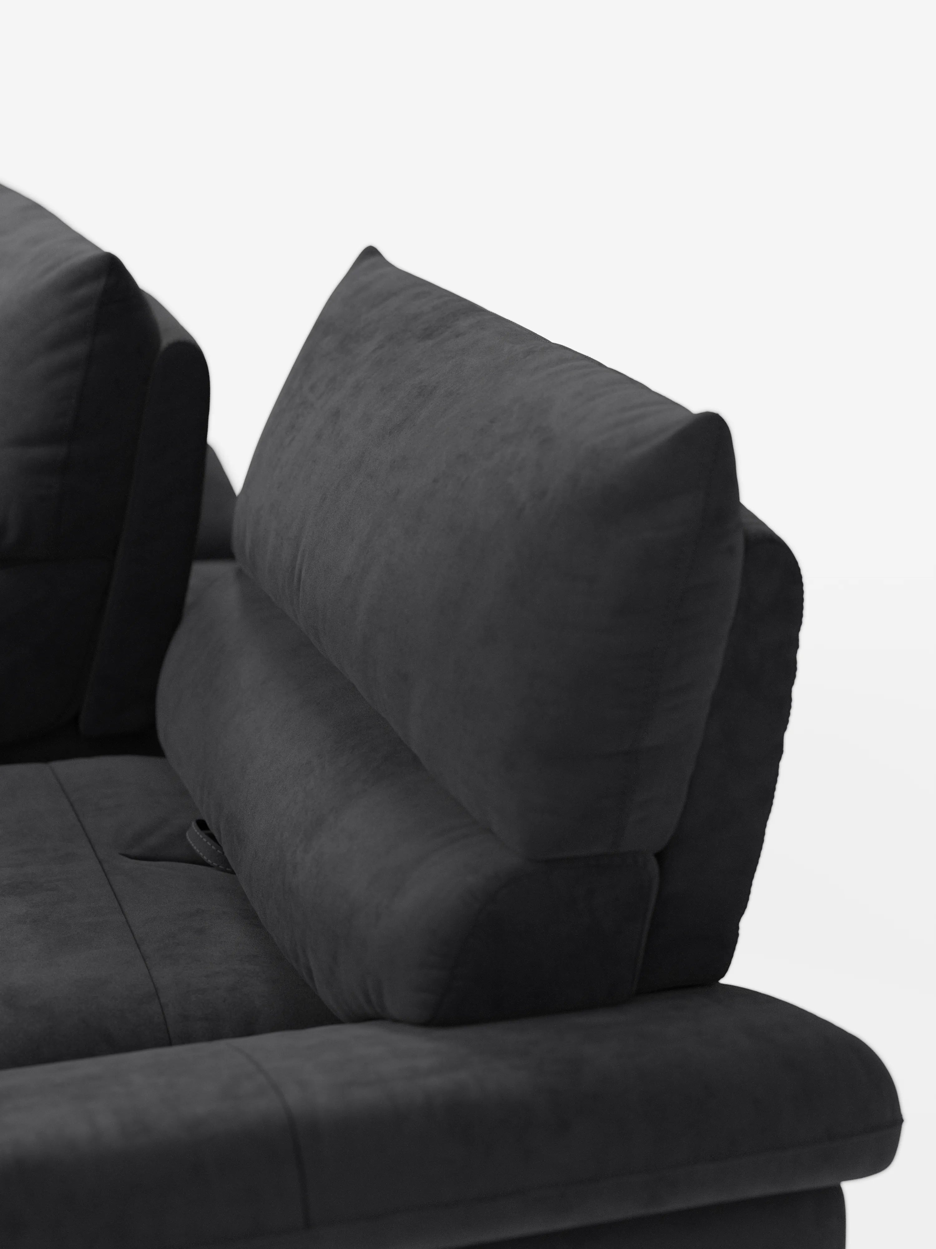 Un primo piano dell’Eclipse Divano, dal design moderno a 2 e 3 posti con schienali traslanti di Divani.Store, mette in risalto il bracciolo destro e lo schienale imbottito su uno sfondo bianco a tinta unita. Il divano è rivestito in un’elegante microfibra T11 smacchiabile di colore grigio scuro, dalla morbida consistenza simile alla pelle scamosciata, mentre gli schienali traslanti garantiscono un comfort modulabile a questo divano contemporaneo, completato da gambe alte.
