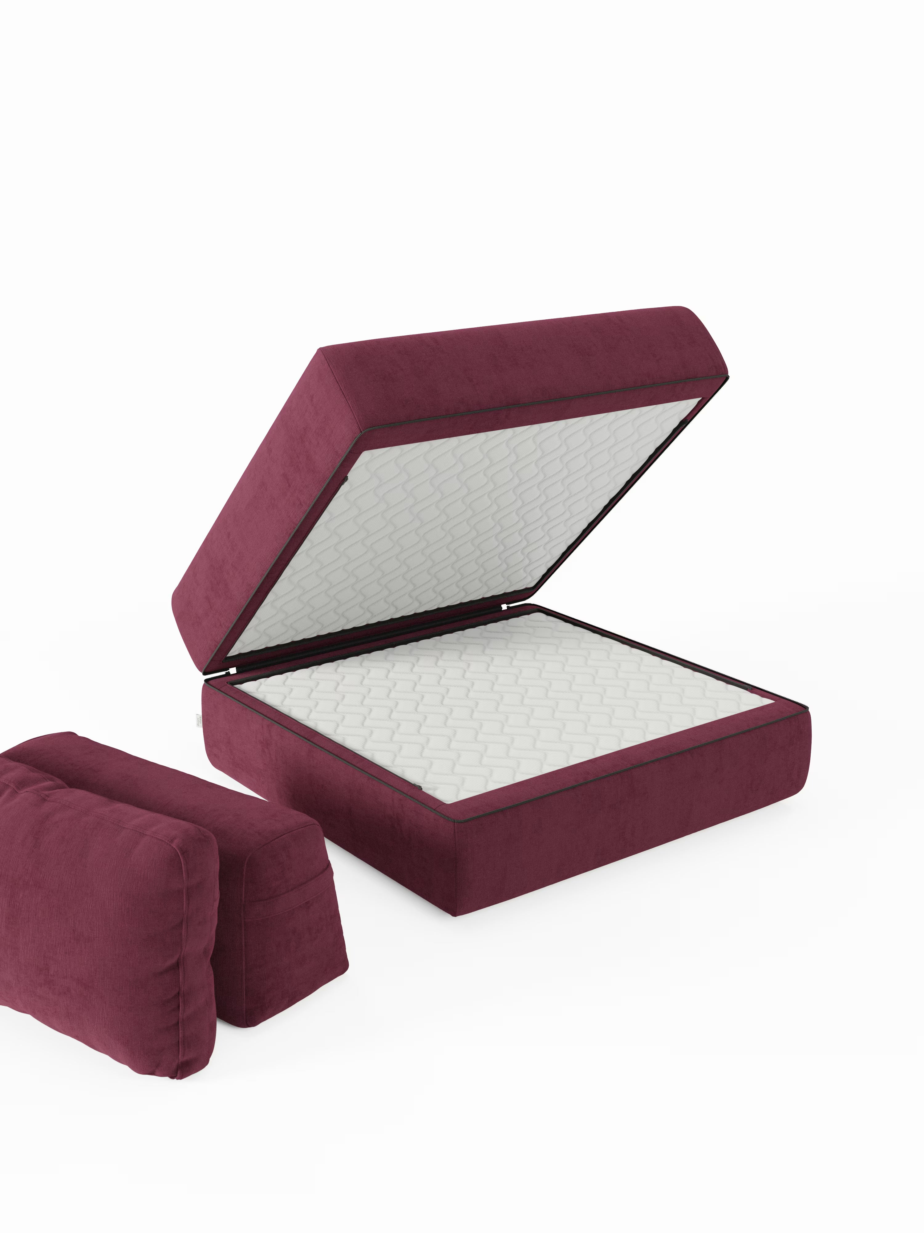 La poltrona letto Rift di Divani.Store, rivestita in tessuto T31 color bordeaux antimacchia, è qui raffigurata ripiegata come divano da terra con schienale rettangolare regolabile e cuscino laterale, entrambi in bordeaux abbinato. Una volta aperto, il divano rivela al suo interno un materasso in memory foam trapuntato bianco alto 24 cm. La scena è ambientata su uno sfondo bianco a tinta unita.