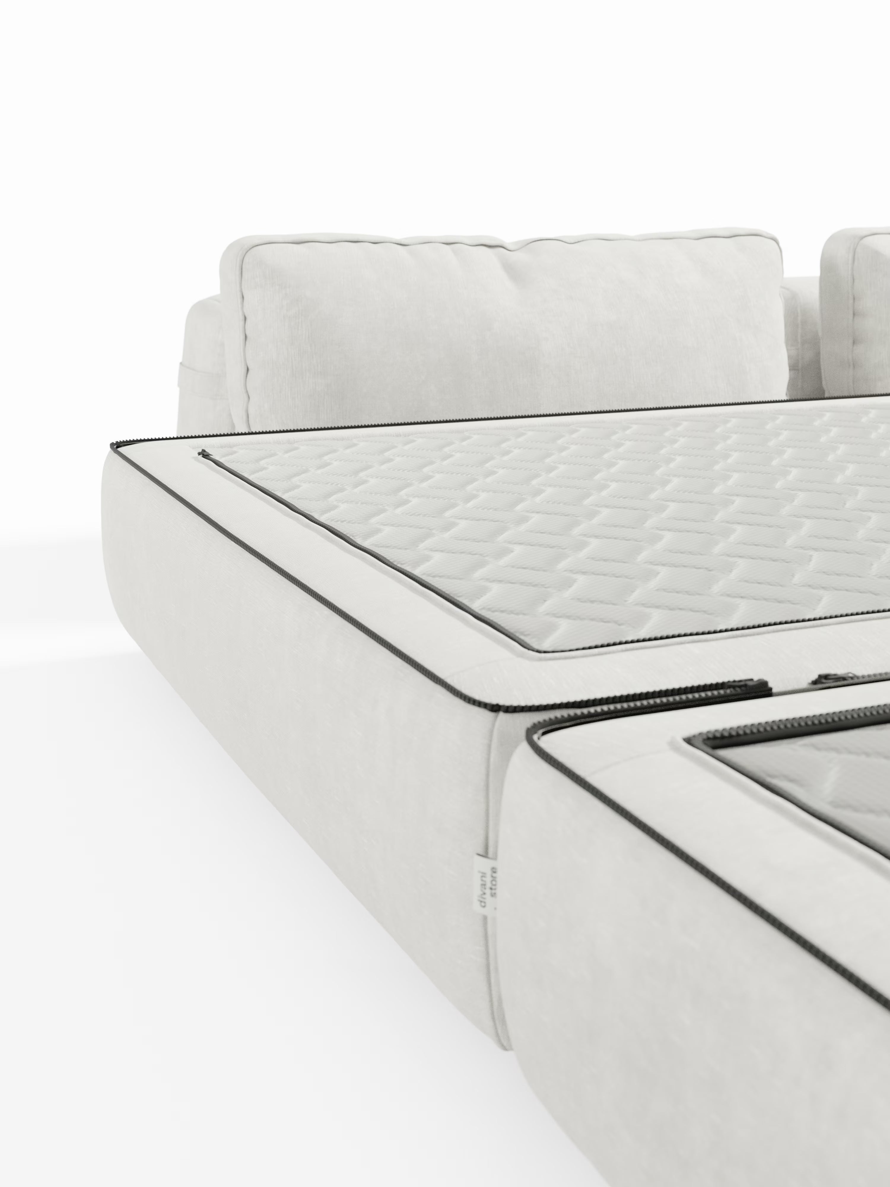 Primo piano del divano letto matrimoniale Rift a 2 e 3 posti di Divani.Store, in bianco con bordino nero, caratterizzato da un motivo trapuntato sui cuscini della seduta. Questo elegante divano letto presenta morbidi cuscini dello schienale rimovibili e cuciture a vista, con una sezione apribile tramite cerniera che rivela l’imbottitura interna, compreso un materasso in memory foam alto 22 cm nella versione T31. Lo sfondo bianco a tinta unita ne esalta il design contemporaneo.