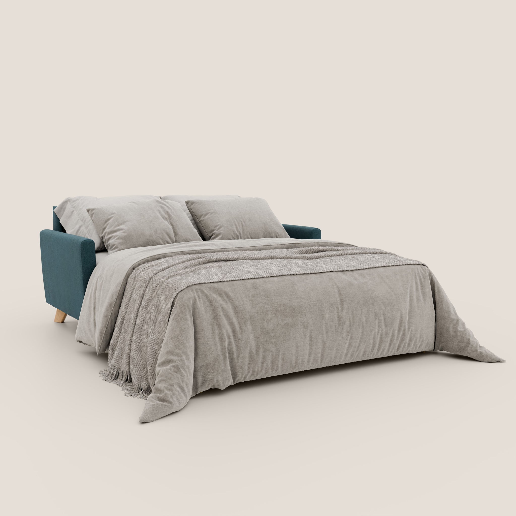 Un divano letto Francy contemporaneo di Divani.Store, esposto in posizione aperta con rivestimento in tessuto PETROLIO e gambe in legno, esemplificativo della raffinata Manifattura Italiana. Presenta una coperta grigio chiaro e due cuscini abbinati su uno sfondo bianco semplice.