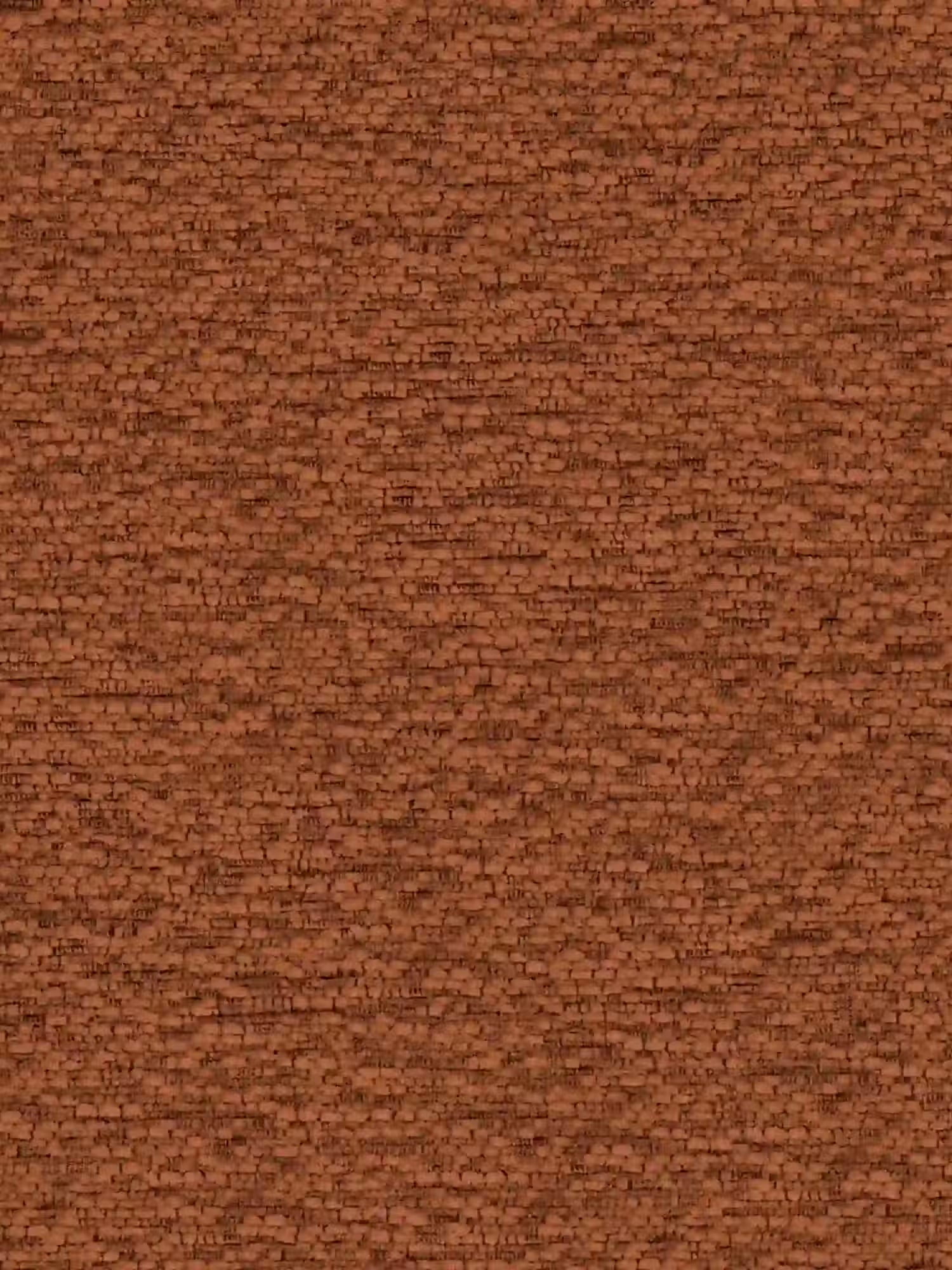 Primo piano di una parete in mattoni rossi a vista, lo sfondo rustico perfetto per la sedia di design Zefira Sedia imbottita con braccioli di Divani.Store: il suo tessuto effetto cotone e la base in metallo color champagne conferiscono calore e stile a qualsiasi sala da pranzo moderna.