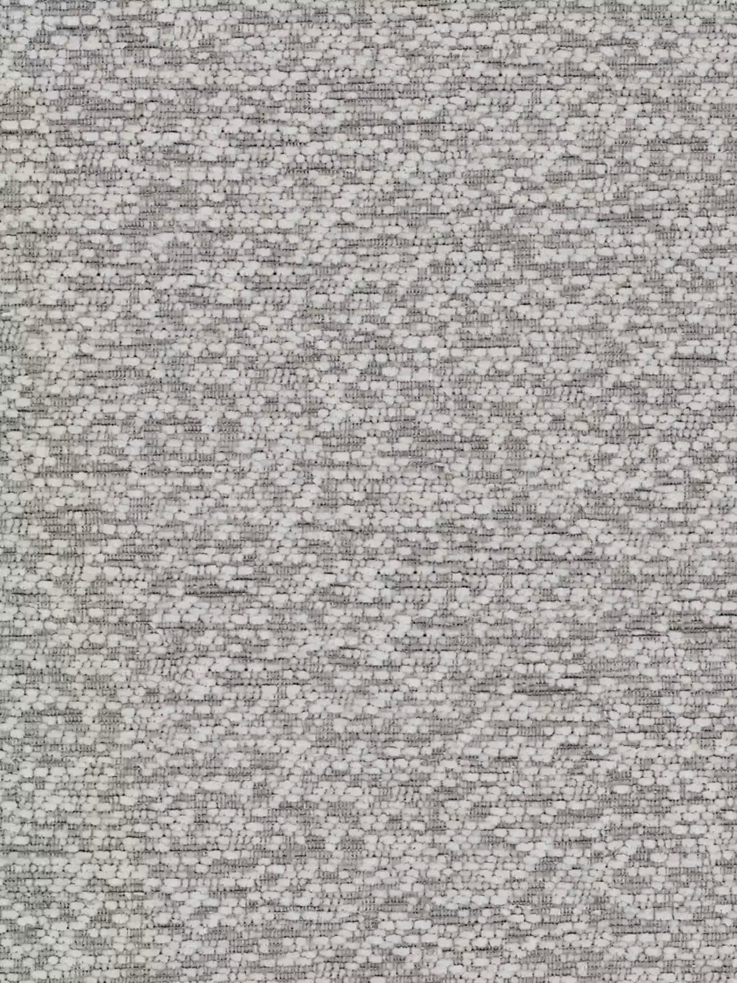 L'immagine è ricoperta da un fitto motivo statico, composto da minuscoli punti e linee irregolari di colore nero, bianco e grigio che ricordano il rumore della TV o la “neve” visiva. Non sono visibili oggetti o forme distinte, il che dà vita a una superficie complessivamente caotica e ricca di texture, che ricorda l’osservazione ravvicinata del tessuto del «ZAYRON», letto imbottito con vano contenitore e morbidi cuscini regolabili di Letti.store, dove il suo morbido tessuto certificato Oeko-Tex® si fonde