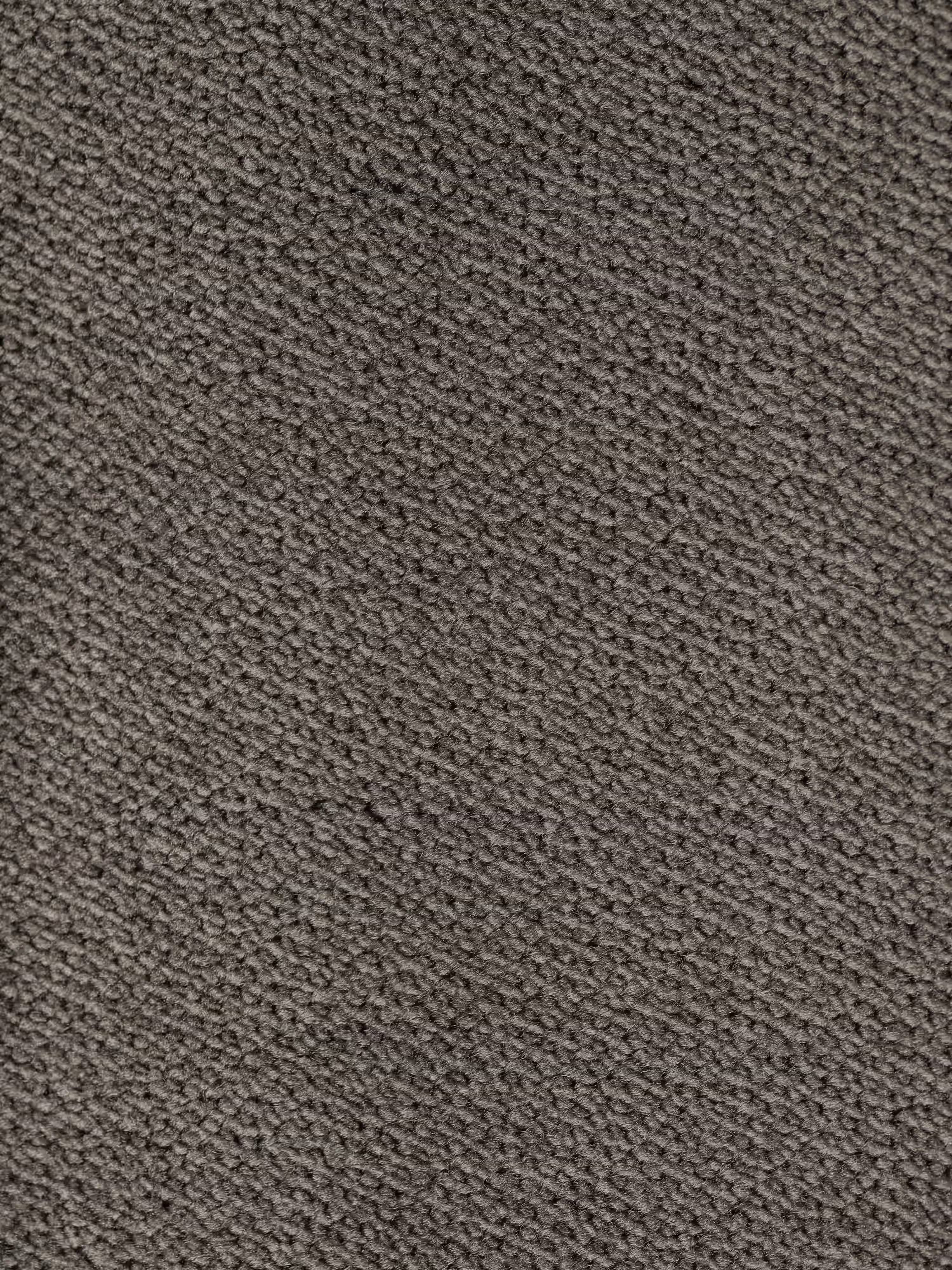 Primo piano del raffinato tessuto effetto velluto grigio scuro (T30) del divano letto di design Capri con piedini alti di Divani.Store. Il tessuto, di produzione italiana e a trama fitta, presenta una consistenza leggermente ruvida con sottili motivi diagonali creati da piccoli fili in rilievo. La superficie appare pulita e priva di macchie visibili o motivi aggiuntivi.