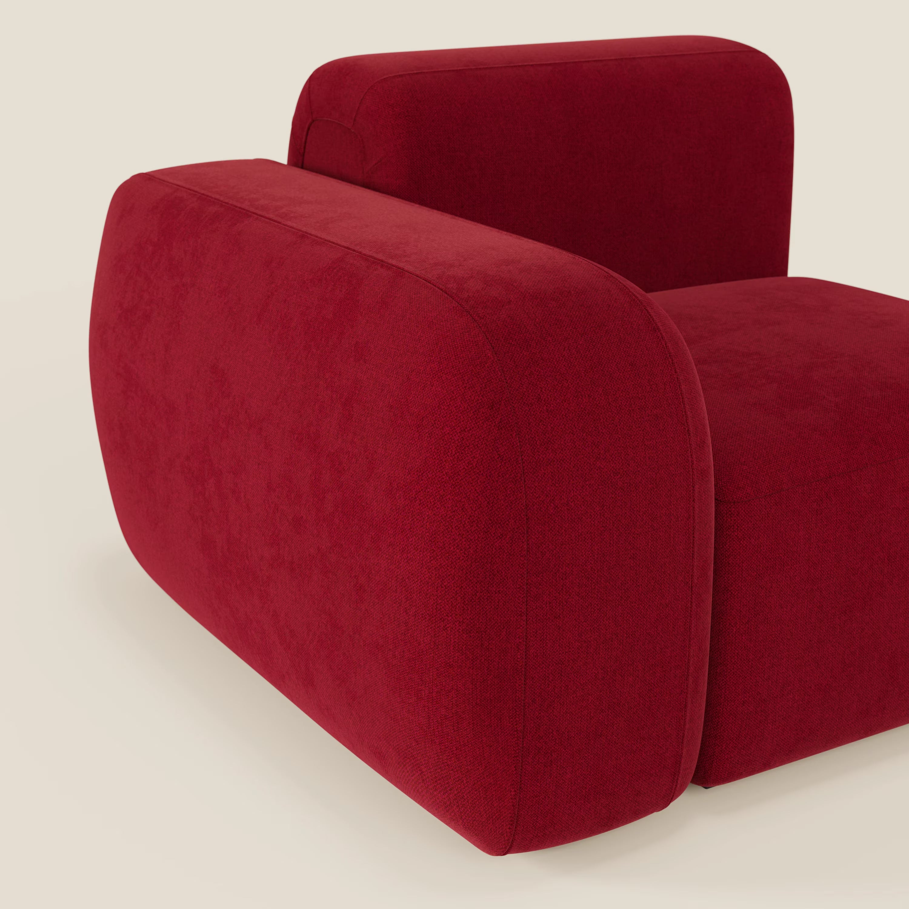 Il BonBon modulo terminale 105 cm di Divani.Store, in tessuto smacchiabile T23 bordeaux, è caratterizzato da braccioli ampi e arrotondati e da un design minimalista e squadrato con curve morbide, perfetto su uno sfondo beige chiaro.