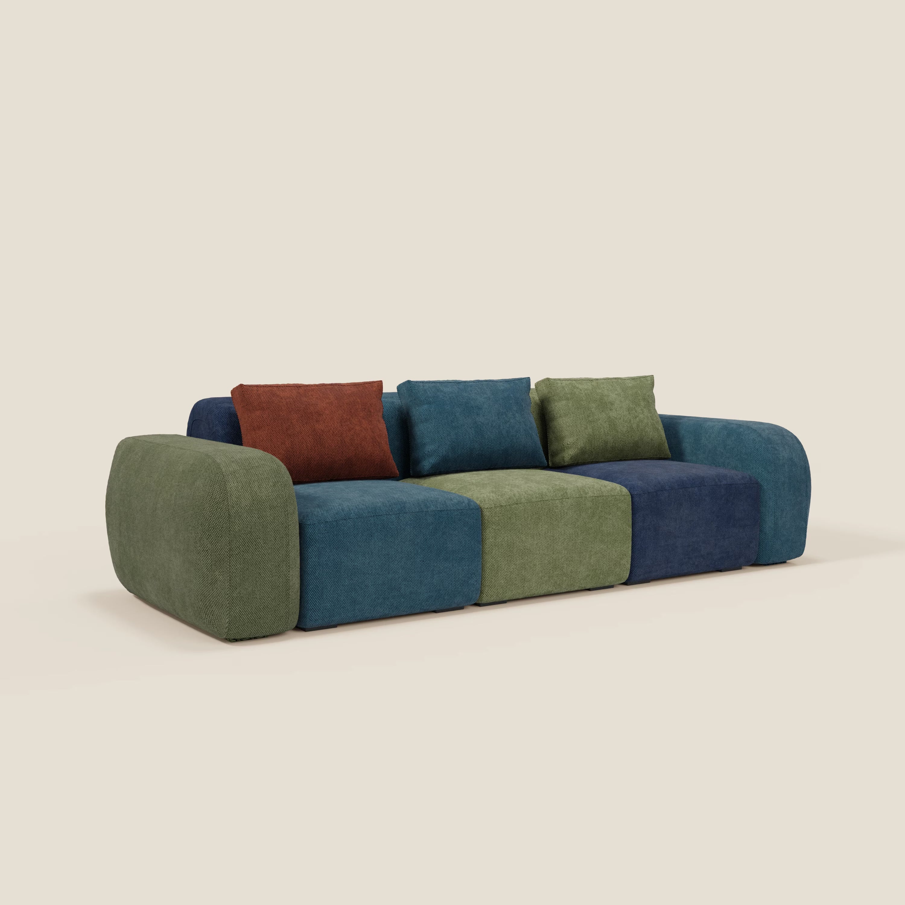 Il divano componibile BonBon 3 sedute - edizione Grande Fratello di Divani.Store è un moderno divano componibile con bordi arrotondati, rivestimento patchwork verde-blu-navy e tre cuscini in ruggine, blu e verde. Prodotto in Italia.