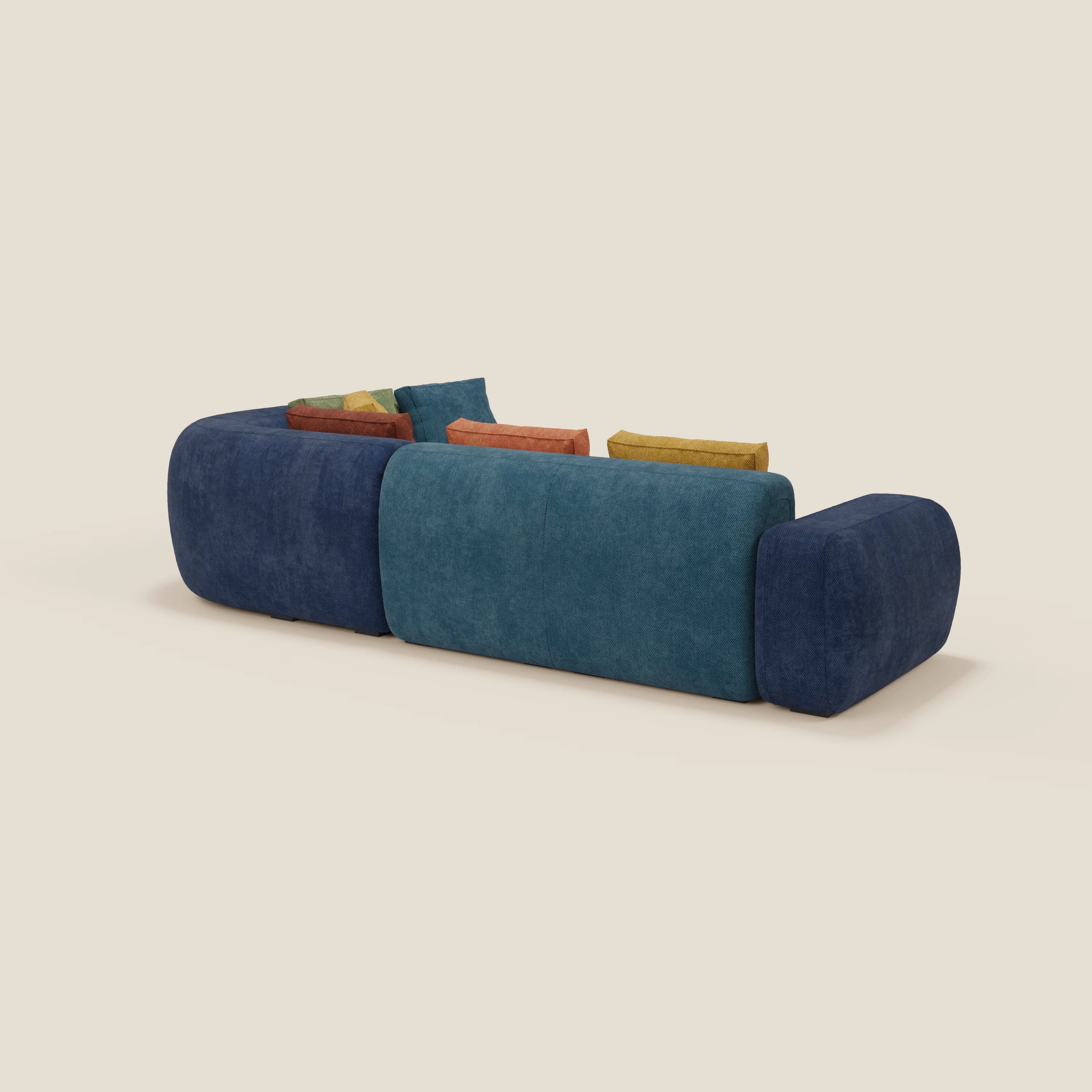 Il divano componibile angolare BonBon - Grande Fratello Edition di Divani.Store è caratterizzato da spigoli arrotondati e da un'imbottitura blu-teal, presentata dallo schienale con cuscini rettangolari arancioni, gialli, verdi e blu su uno sfondo chiaro.